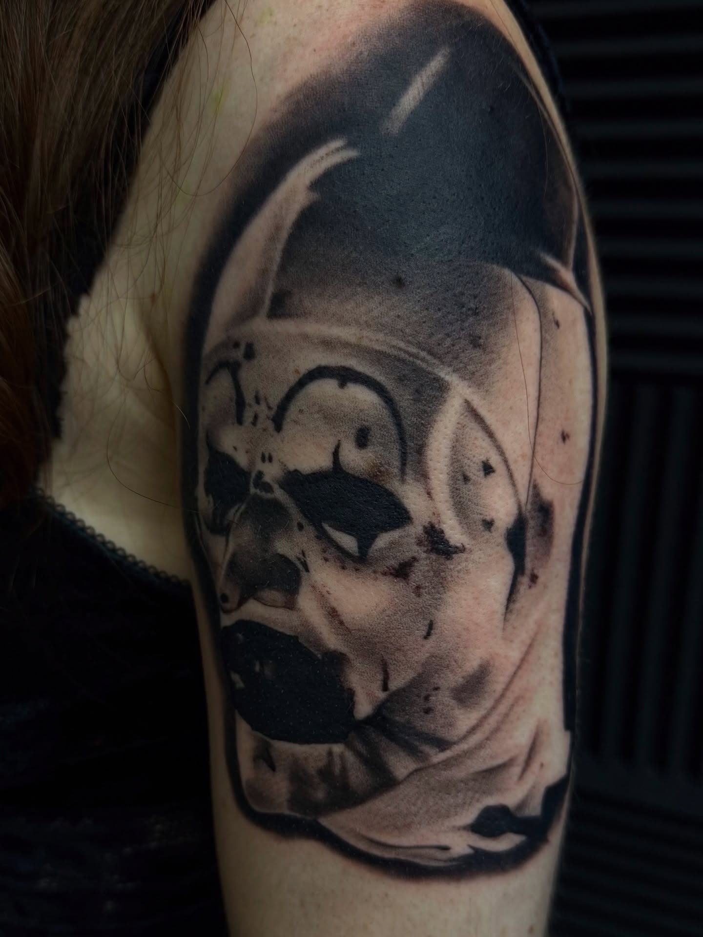 Mask realism tattoo on the shoulder by Nick Campbell