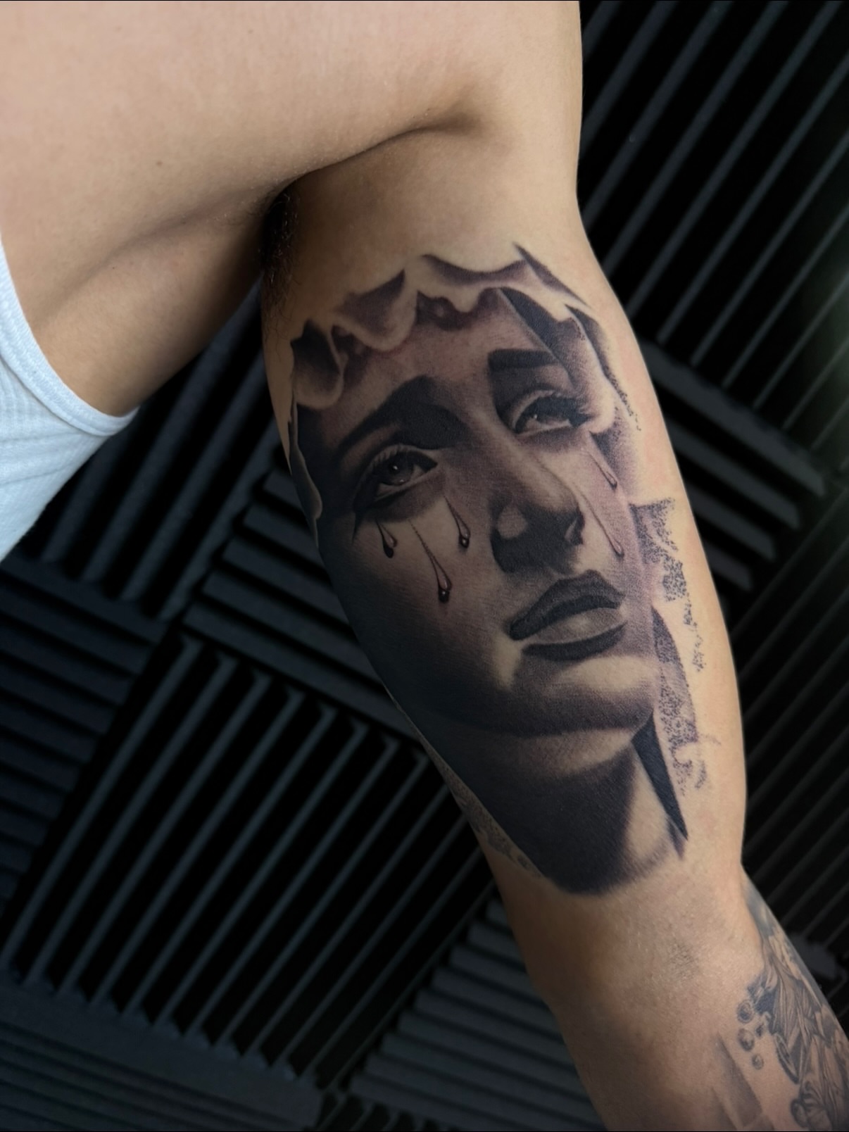 Portrait realism tattoo on the forearm by Nick Campbell