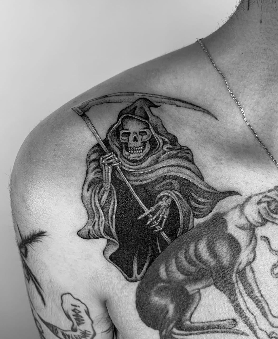 Grim reaper black and grey tattoo on the shoulder by The One Who’s Always Drawing