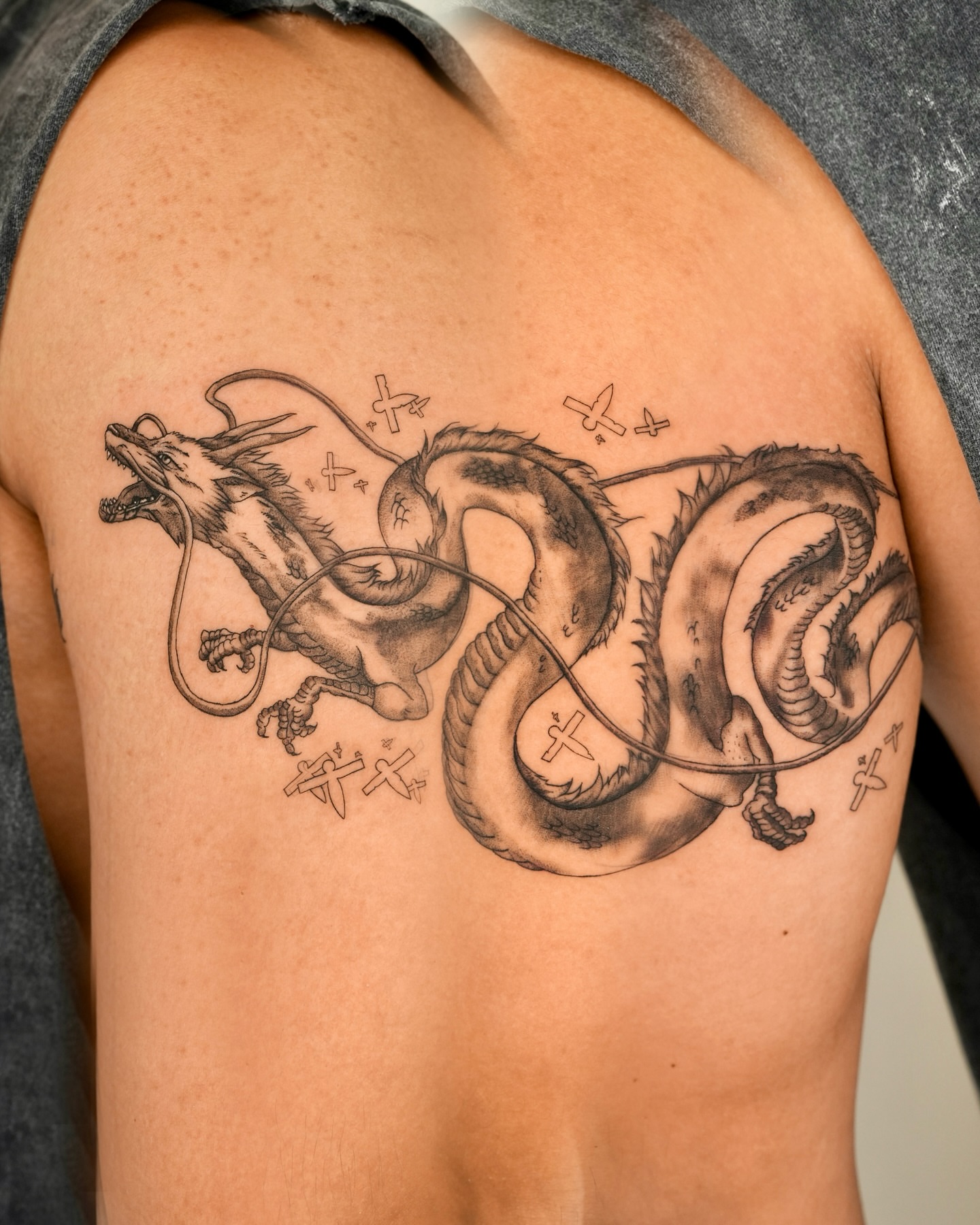 Dragon black and grey tattoo on the chest by YUN