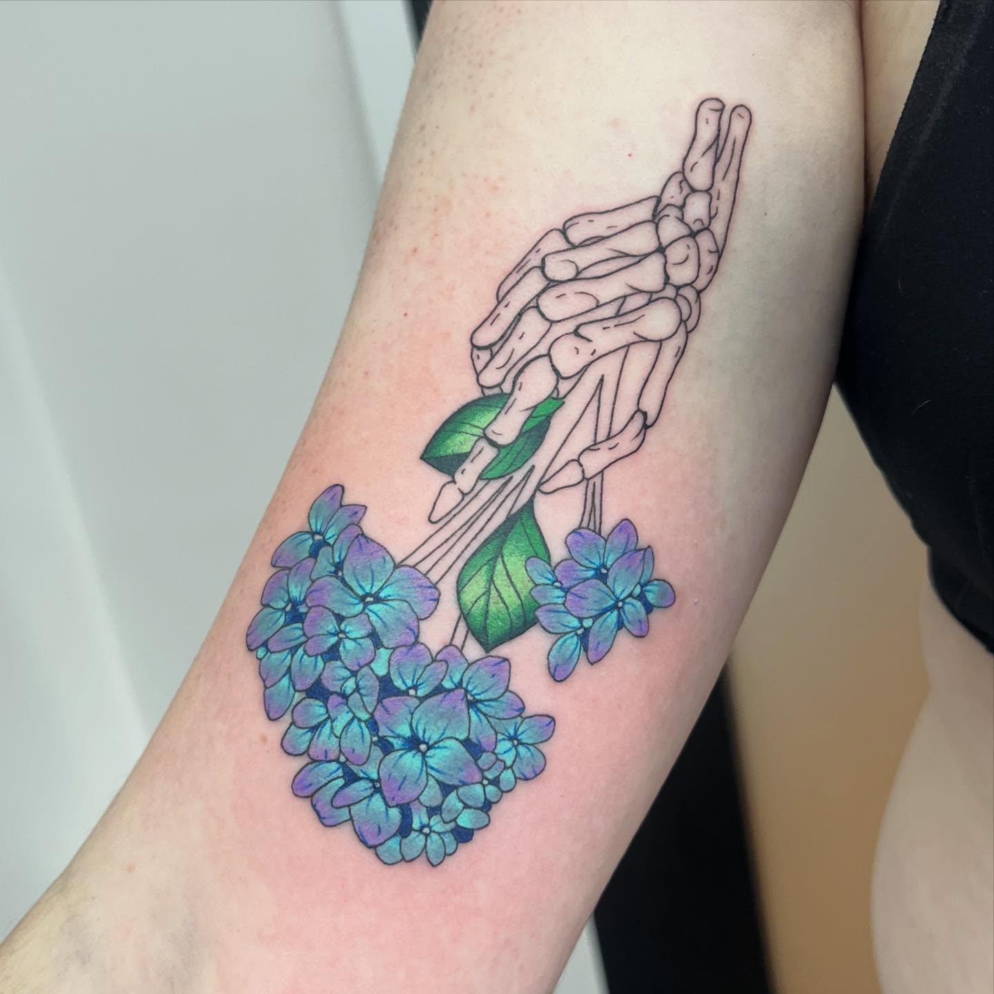 Bone hands and hydrangeas realism tattoo on the forearm by 🍄‍🟫🍄Moth🍄🍄‍🟫
