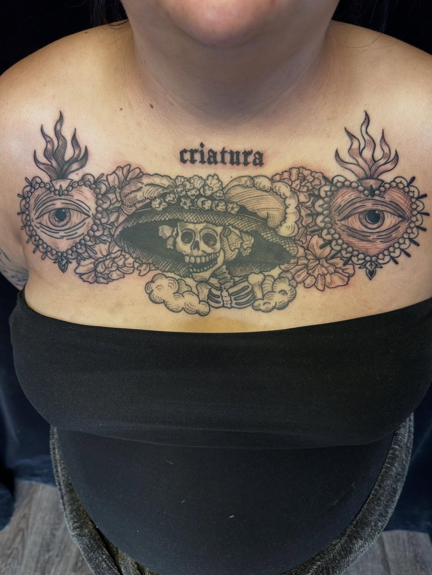 Skull with sombrero Chicano tattoo on the chest by Lora Bird