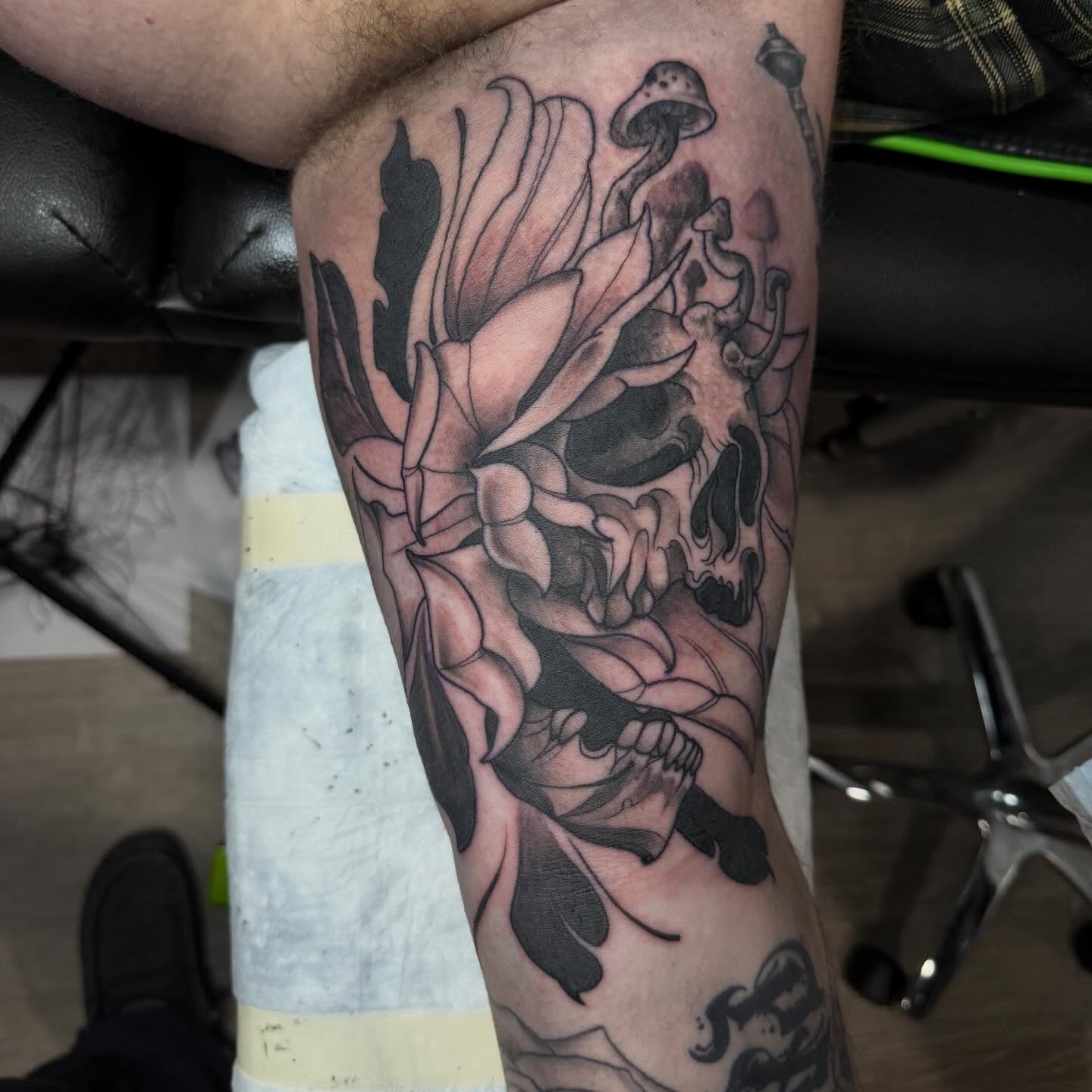 Lotus flower black and grey tattoo on the forearm by Matthew Gordon