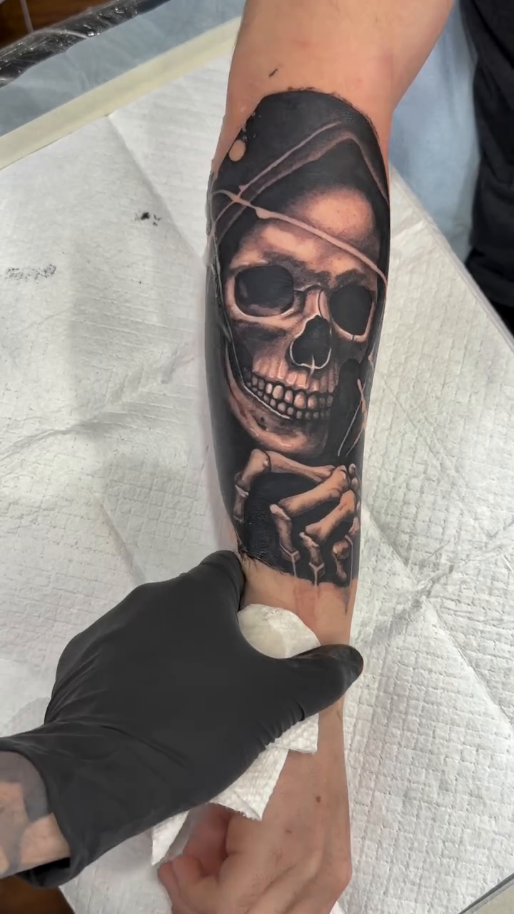 Skull with hat realism tattoo by caleb coley