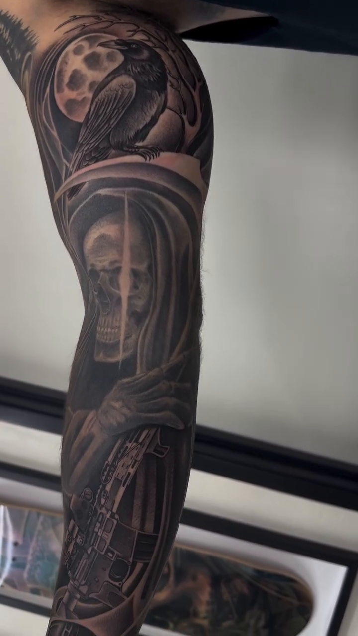 Grim Reaper with rifle and raven dark realism tattoo by Kyle Lopez, Union City, California