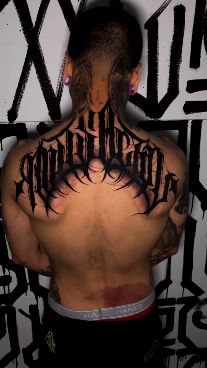 Gothic lettering on back Chicano tattoo on the back by Nick Andrade Las Vegas Tattoo Artist