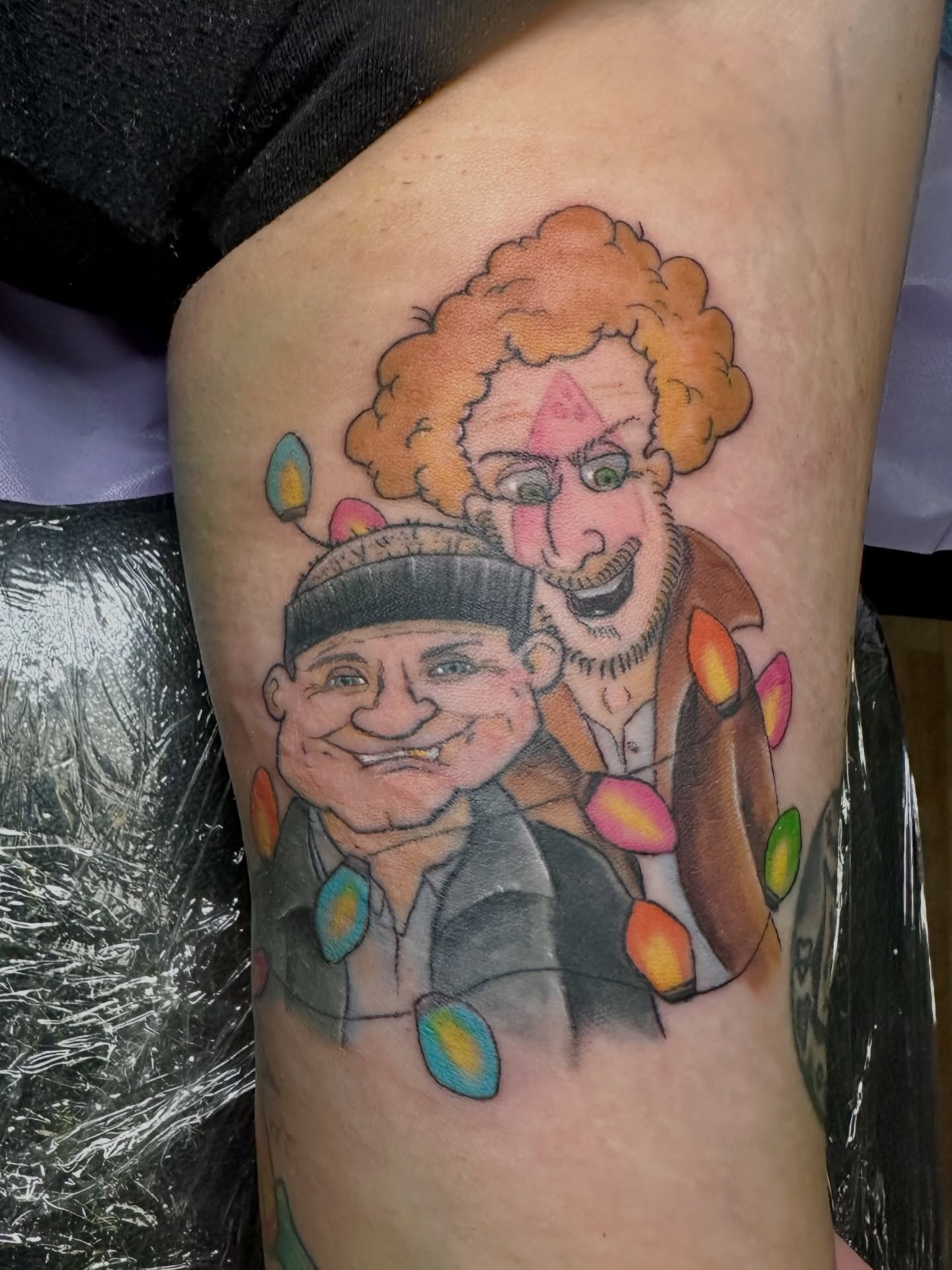 Clowns realism tattoo on the thigh by Chris Gray