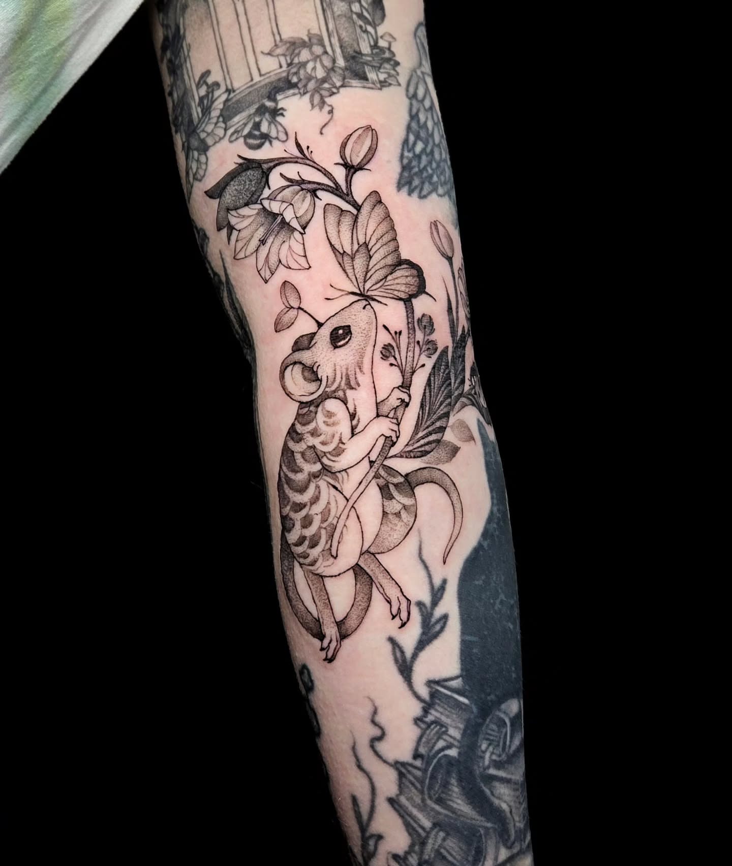 Mouse and flowers realism tattoo on the forearm by Jesseca Chinchilla