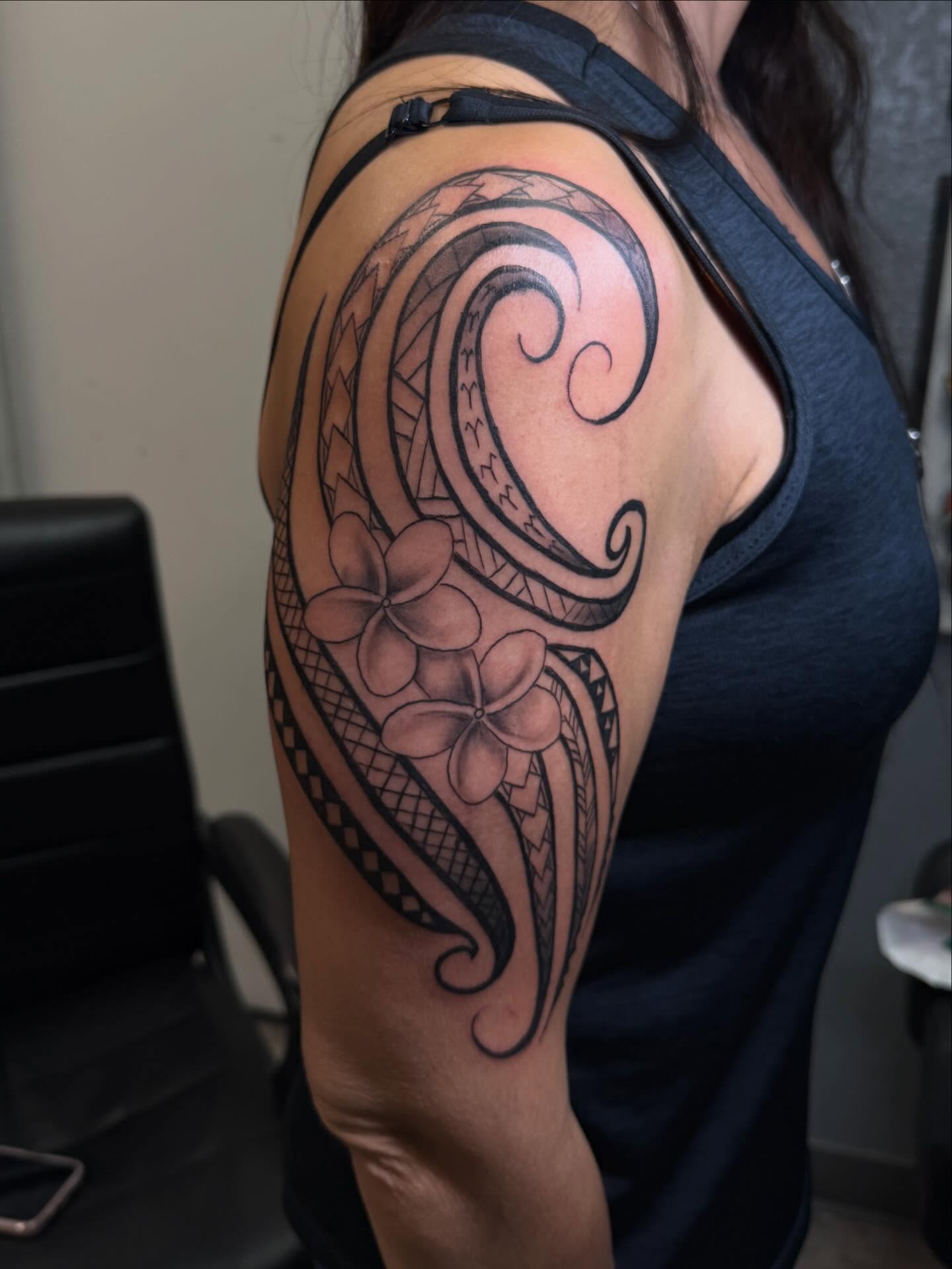 Plumeria flowers tribal tattoo on the shoulder by Kevin, Las Vegas, Nevada