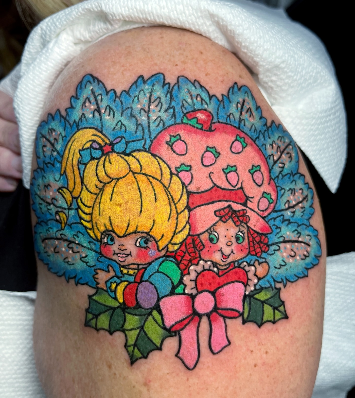 Strawberry shortcake characters illustrative tattoo on the shoulder by Alena McDonald
