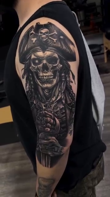 Pirate skull realism tattoo by Tattoos By Kique