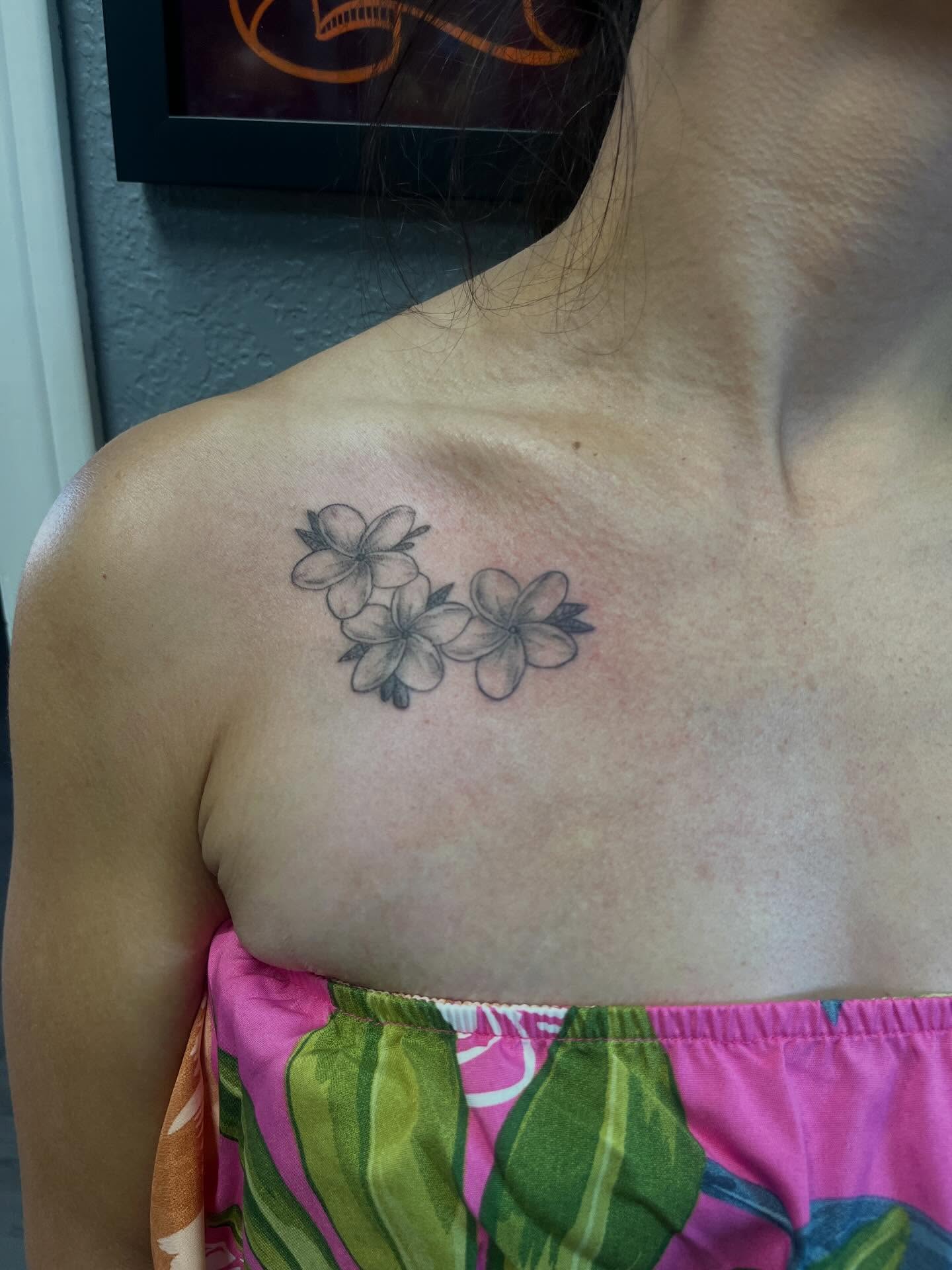 Plumeria flowers black and grey tattoo on the chest by Kevin, Las Vegas, Nevada