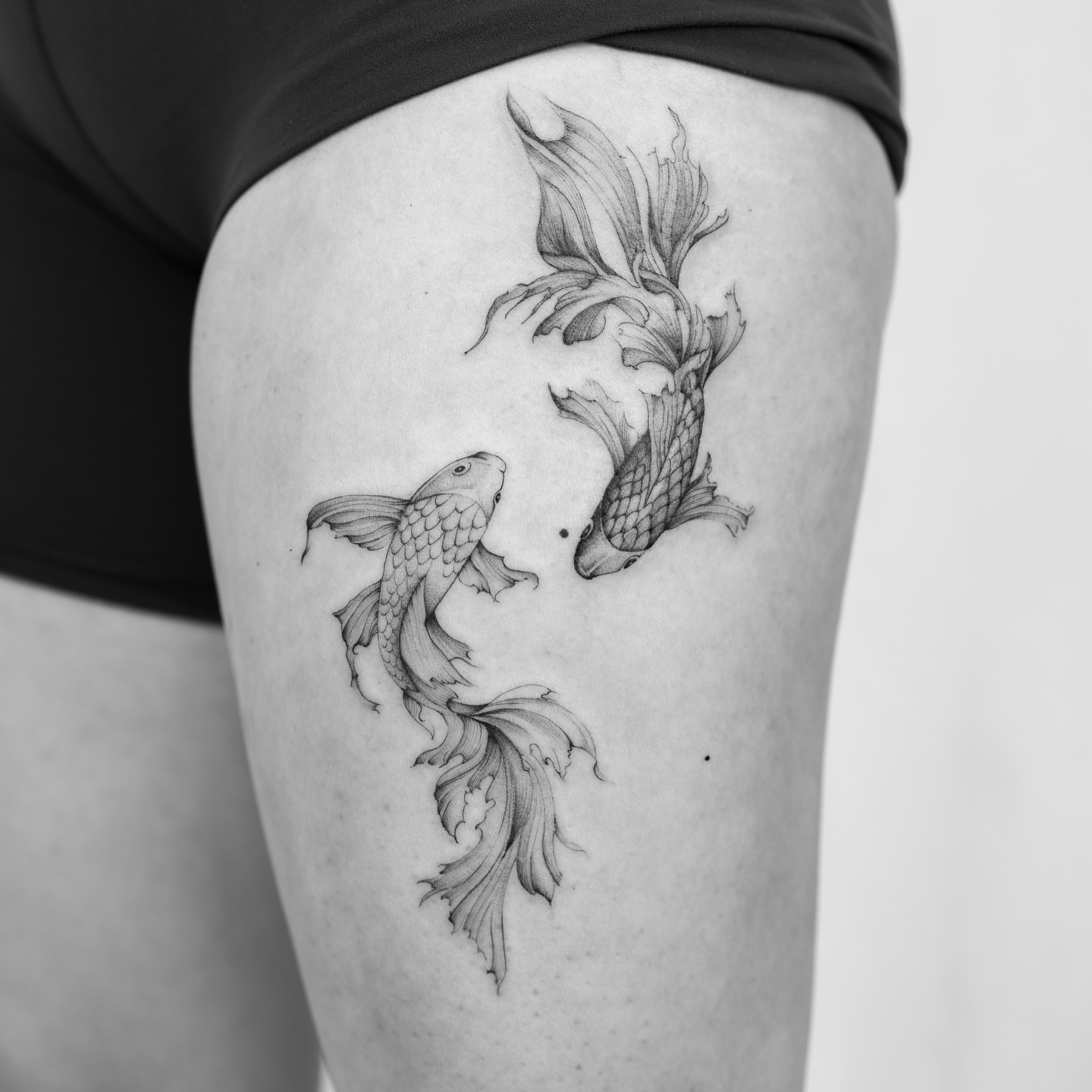 Koi fish realism tattoo on the thigh by Leo Gao