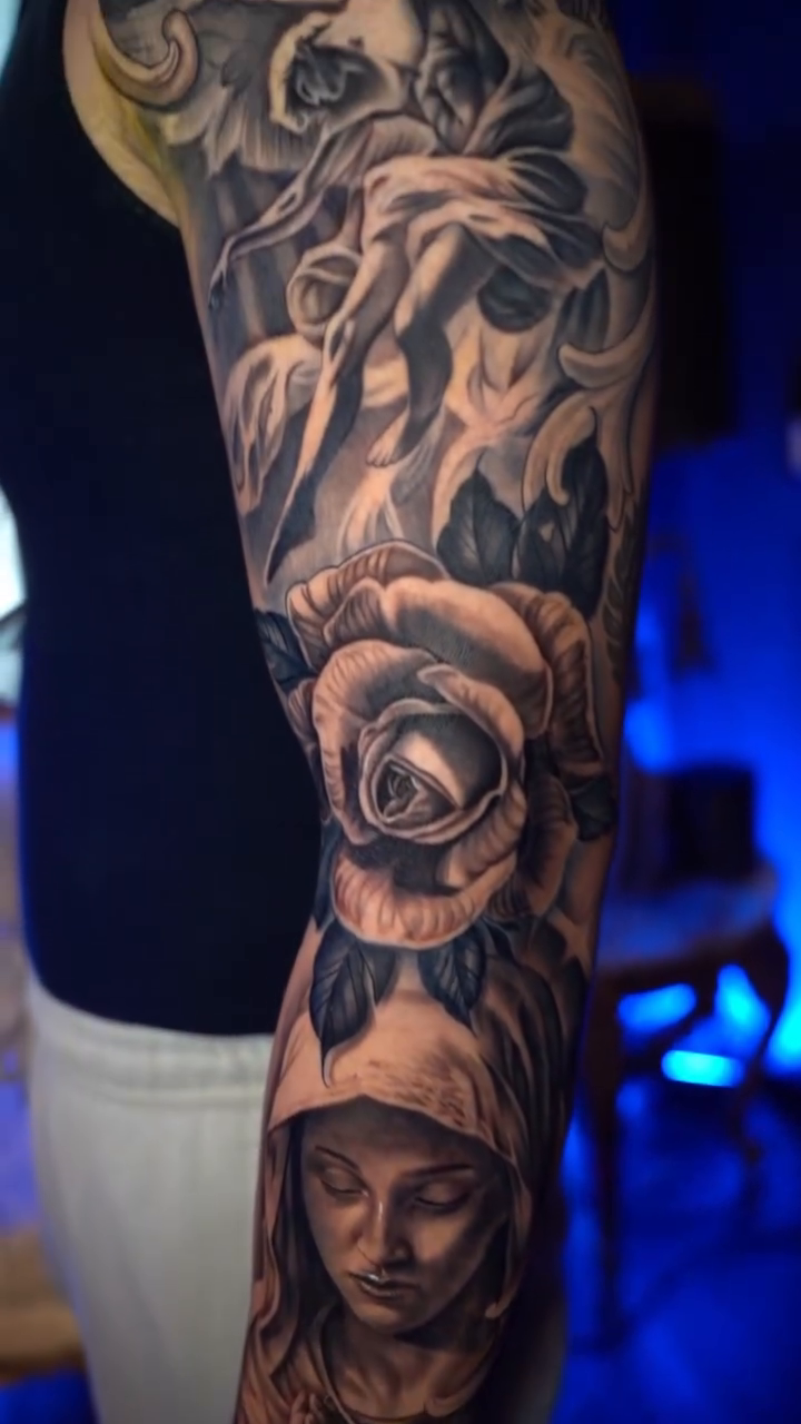 Virgin Mary and roses realism tattoo by Cristian Rodriguez