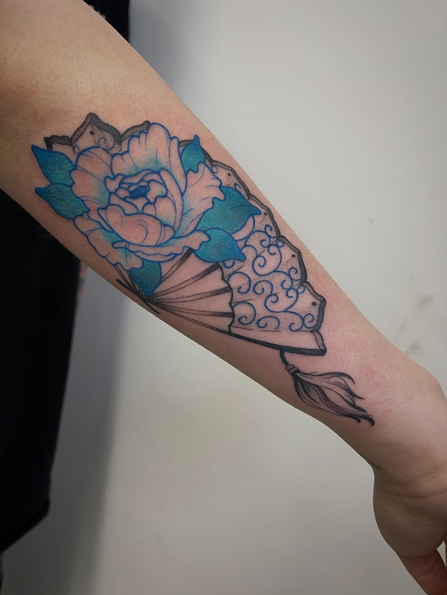 Peony and fan japanese irezumi tattoo on the forearm by Miesha Busker