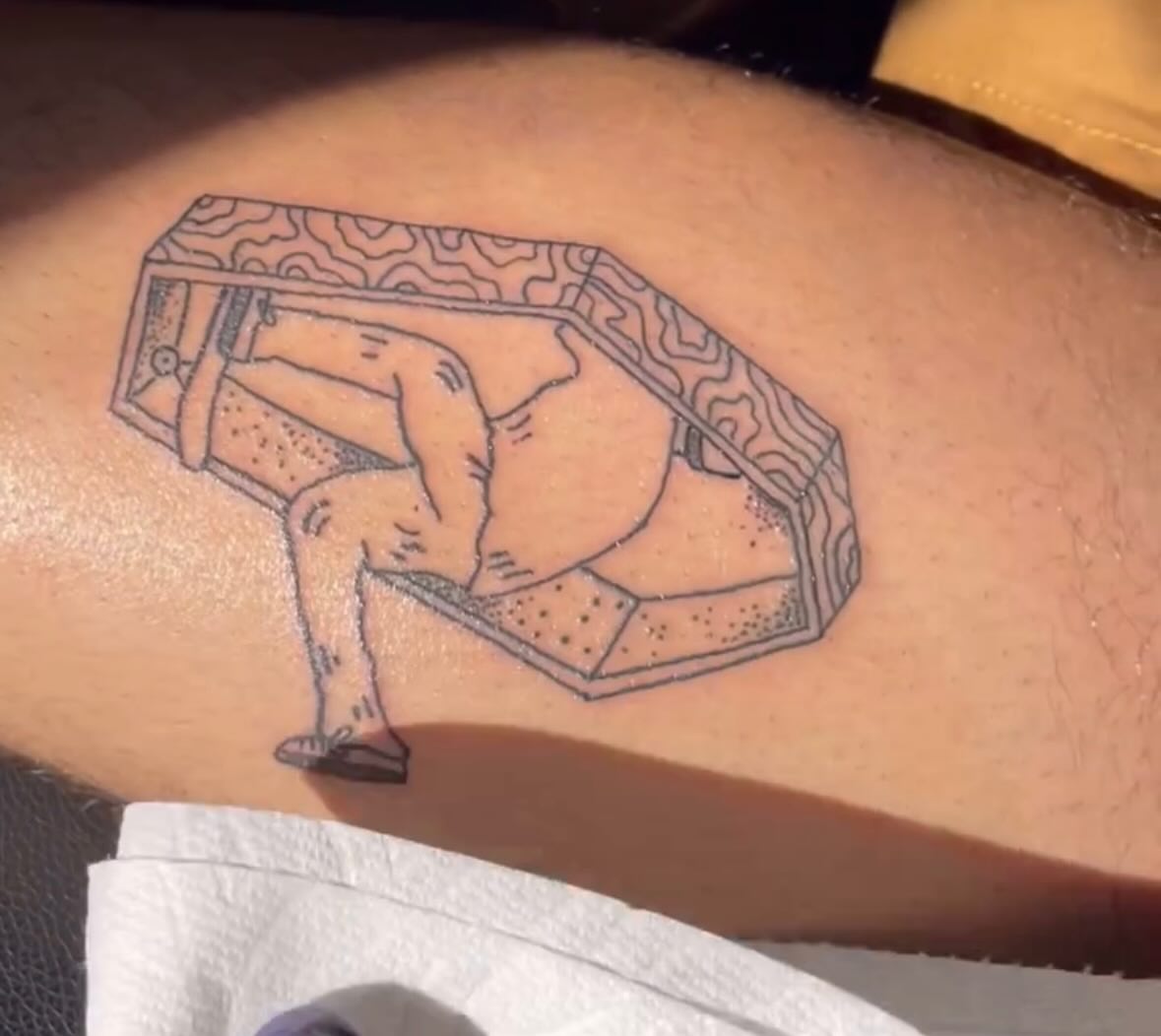 Man in coffin dotwork tattoo on the forearm by ART