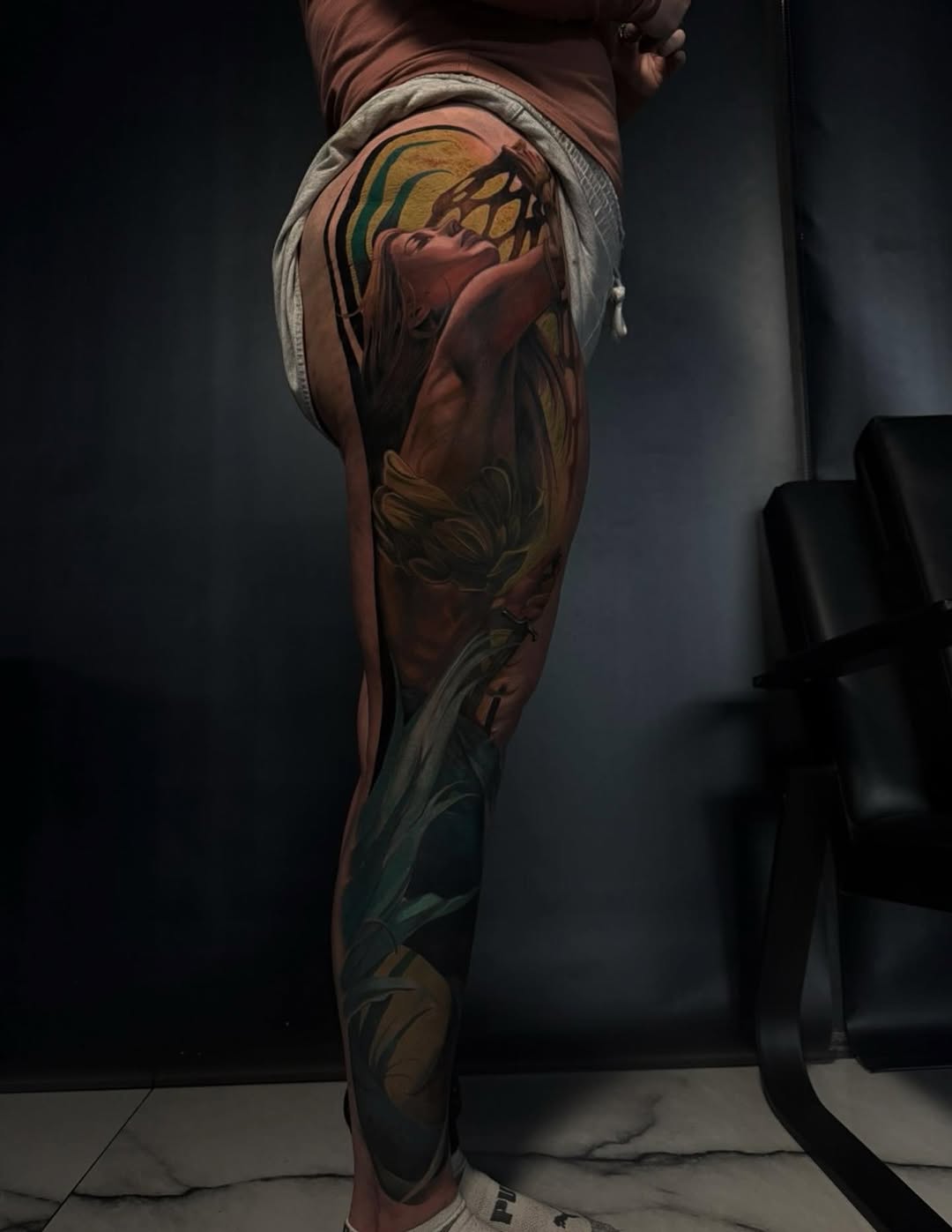 Woman's portrait with abstract elements surrealism tattoo on the thigh by Austin Jones
