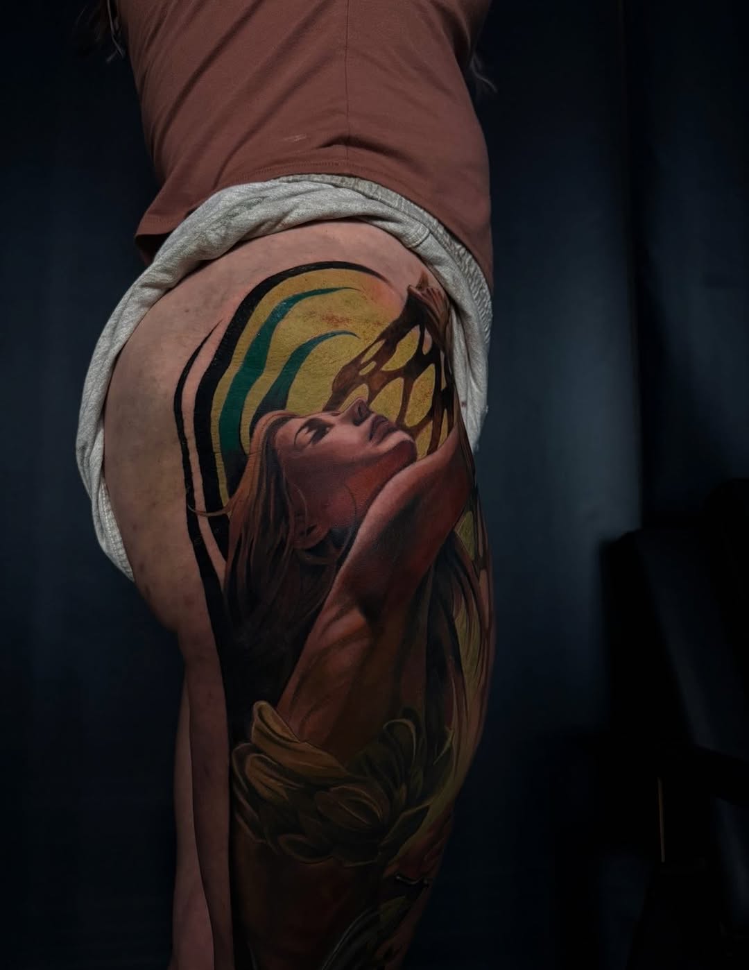Woman's portrait with abstract background neo-traditional tattoo on the thigh by Austin Jones