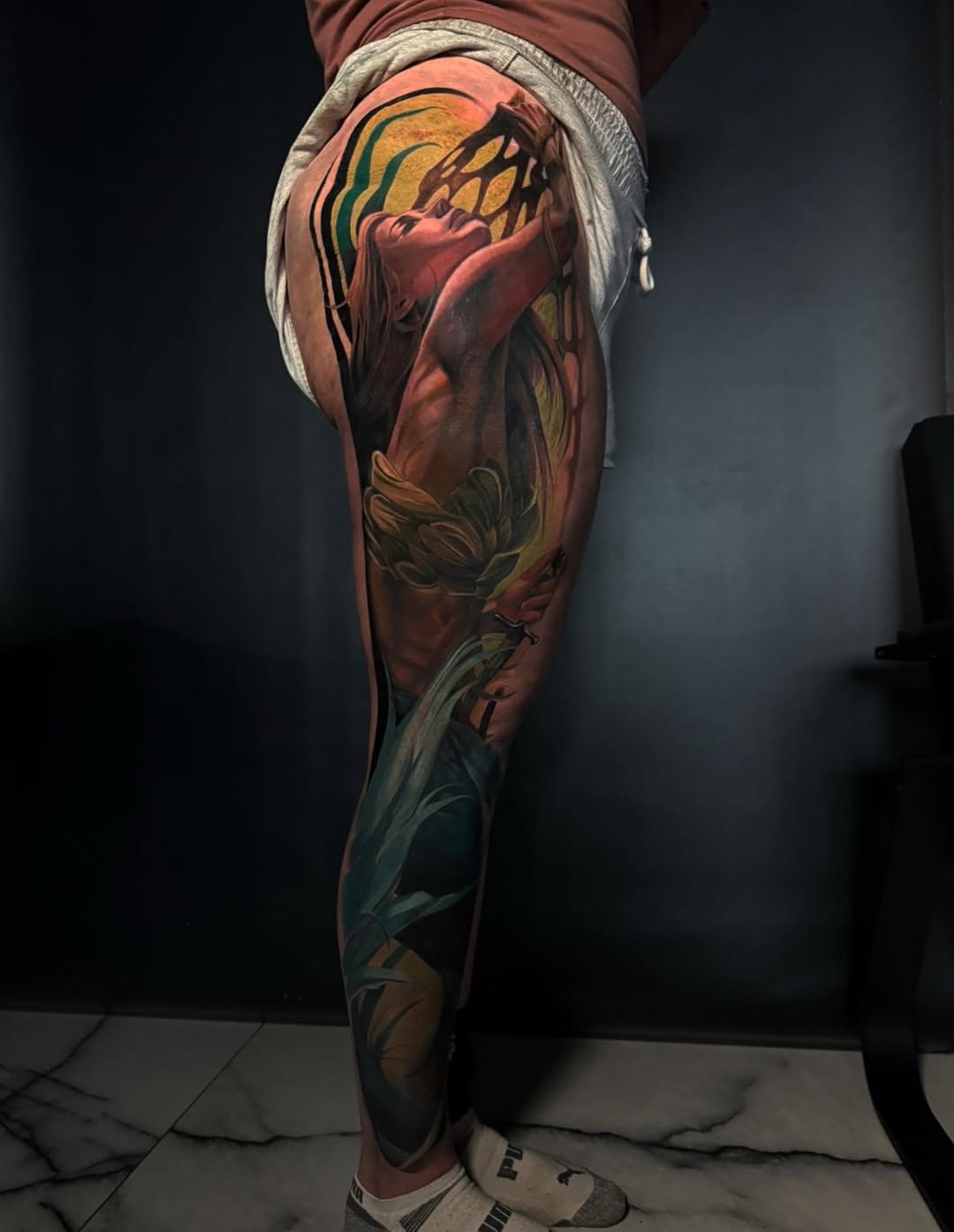 Surrealism tattoo on the thigh by Austin Jones