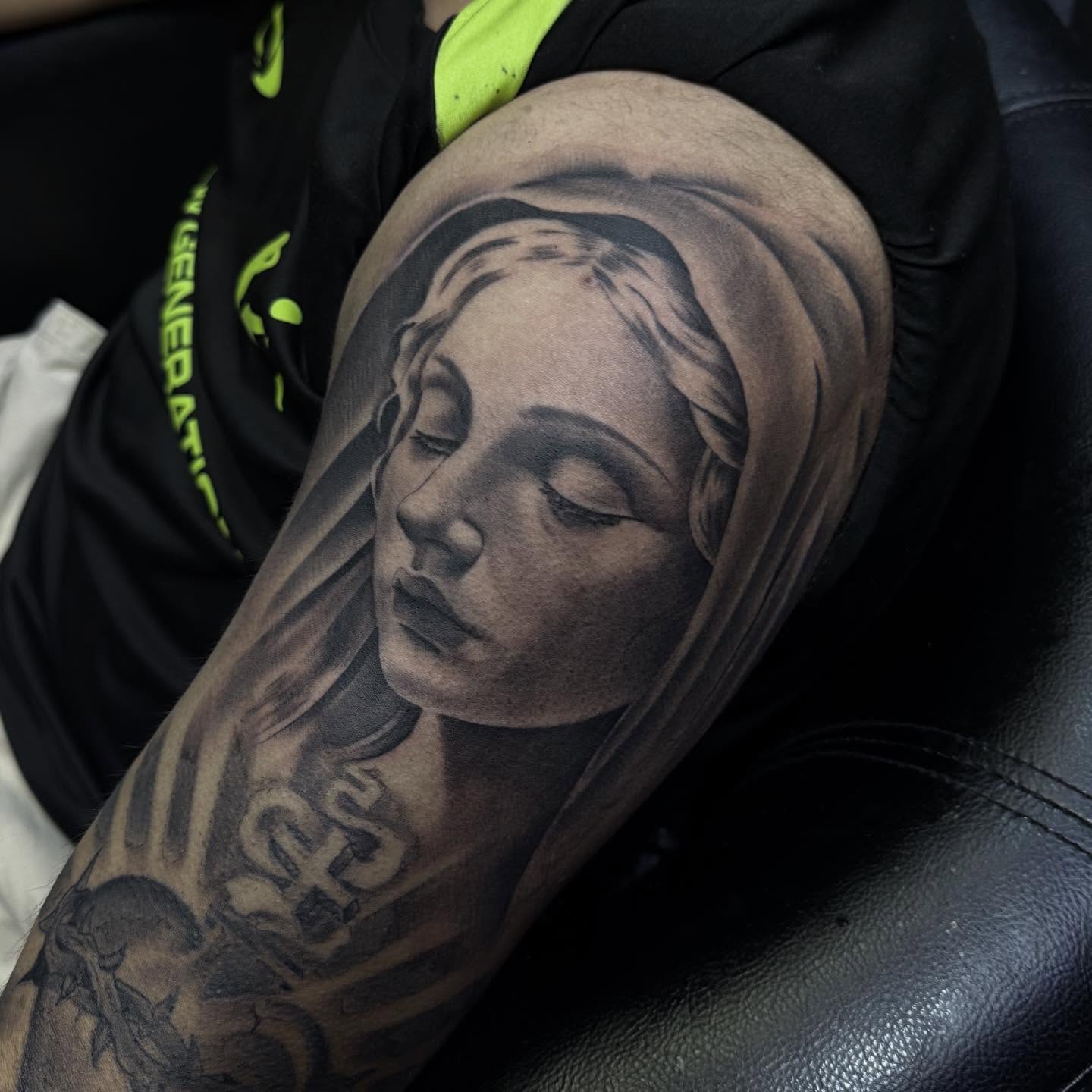 Woman's face realism tattoo on the forearm by Tattoosxjoseph