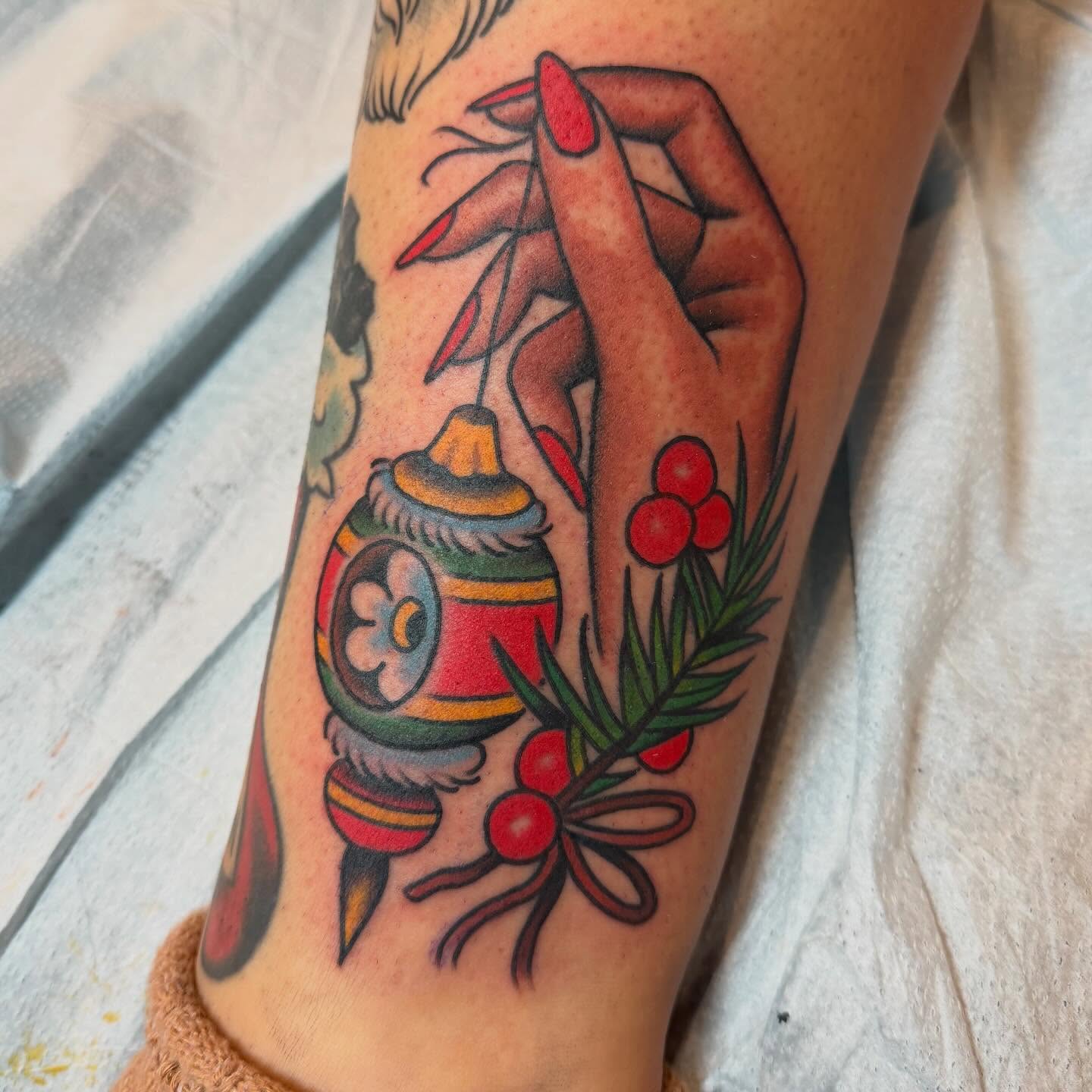 Christmas ornament American traditional tattoo on the forearm by Grandma Approved, Chicago, Illinois