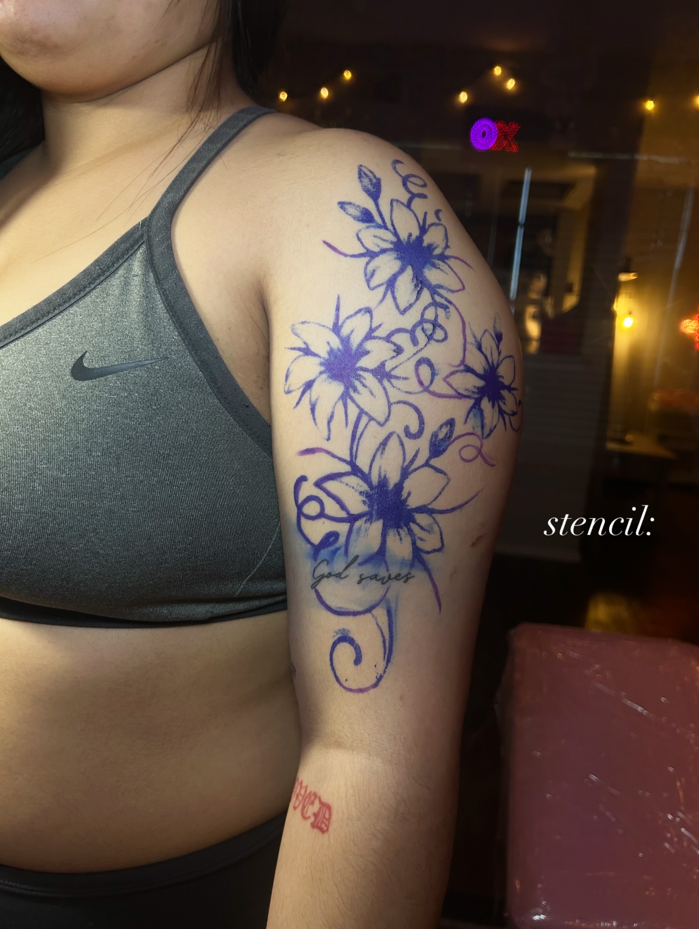 Floral design new school tattoo on the upper arm by @tattoosbyskyeee