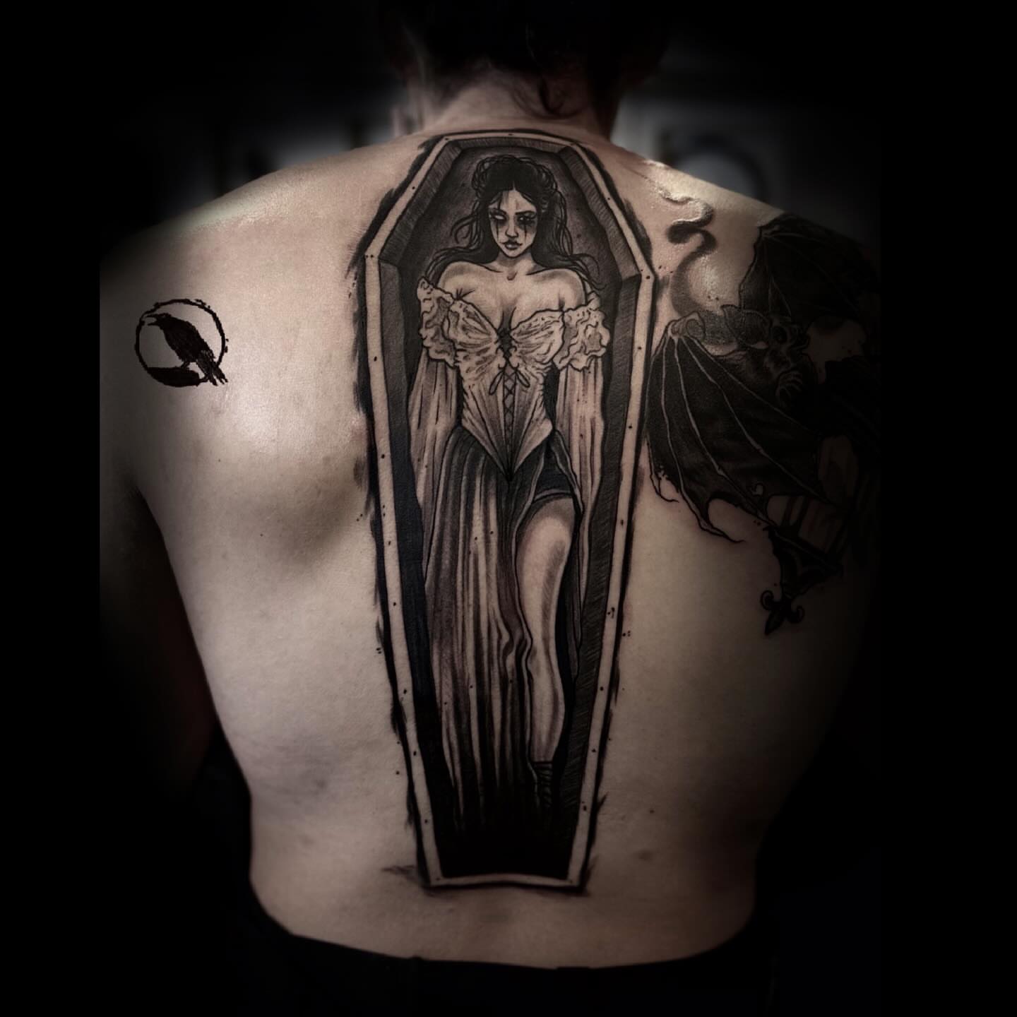 Woman in coffin realism tattoo on the back by 𝕽𝖎𝖌𝖊𝖗𝖘 𝕳𝖆𝖒𝖟𝖆, San Francisco, California