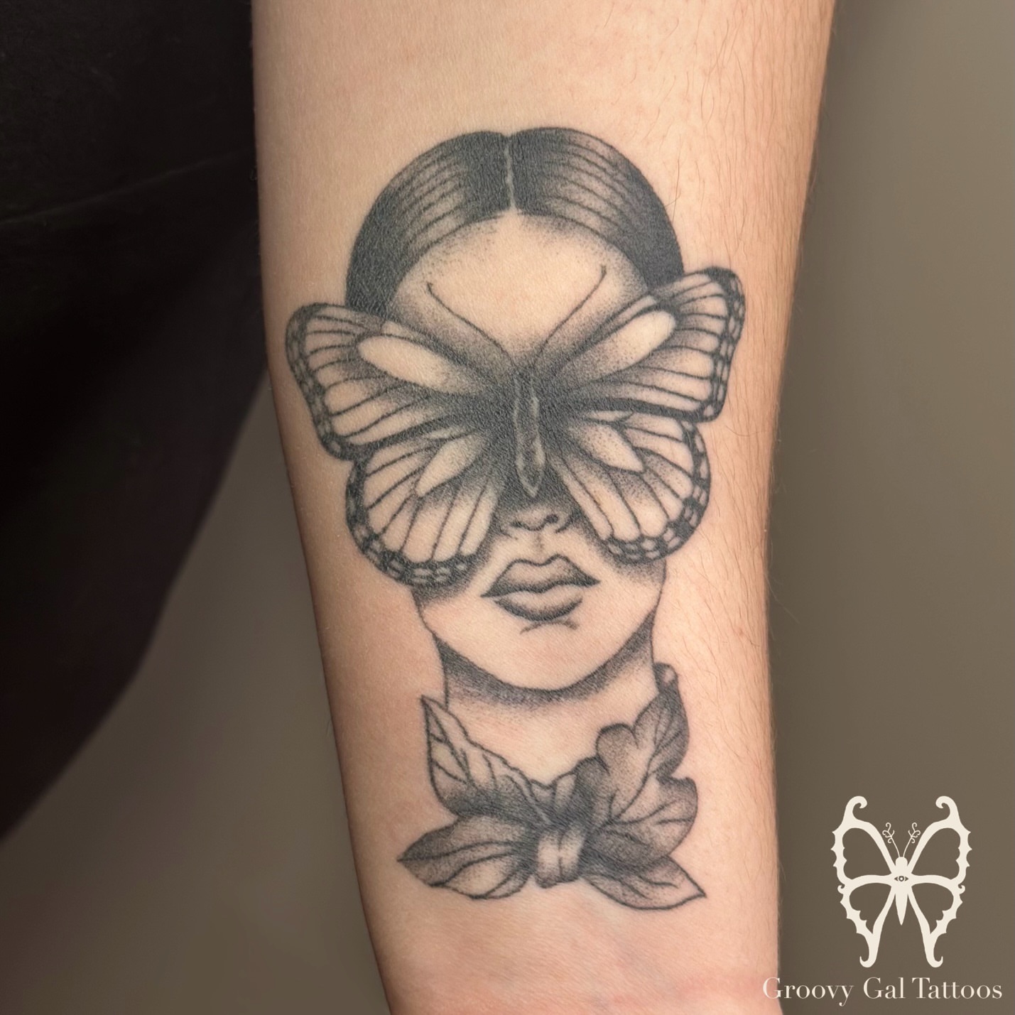 Butterfly and woman realism tattoo on the forearm by Groovy P