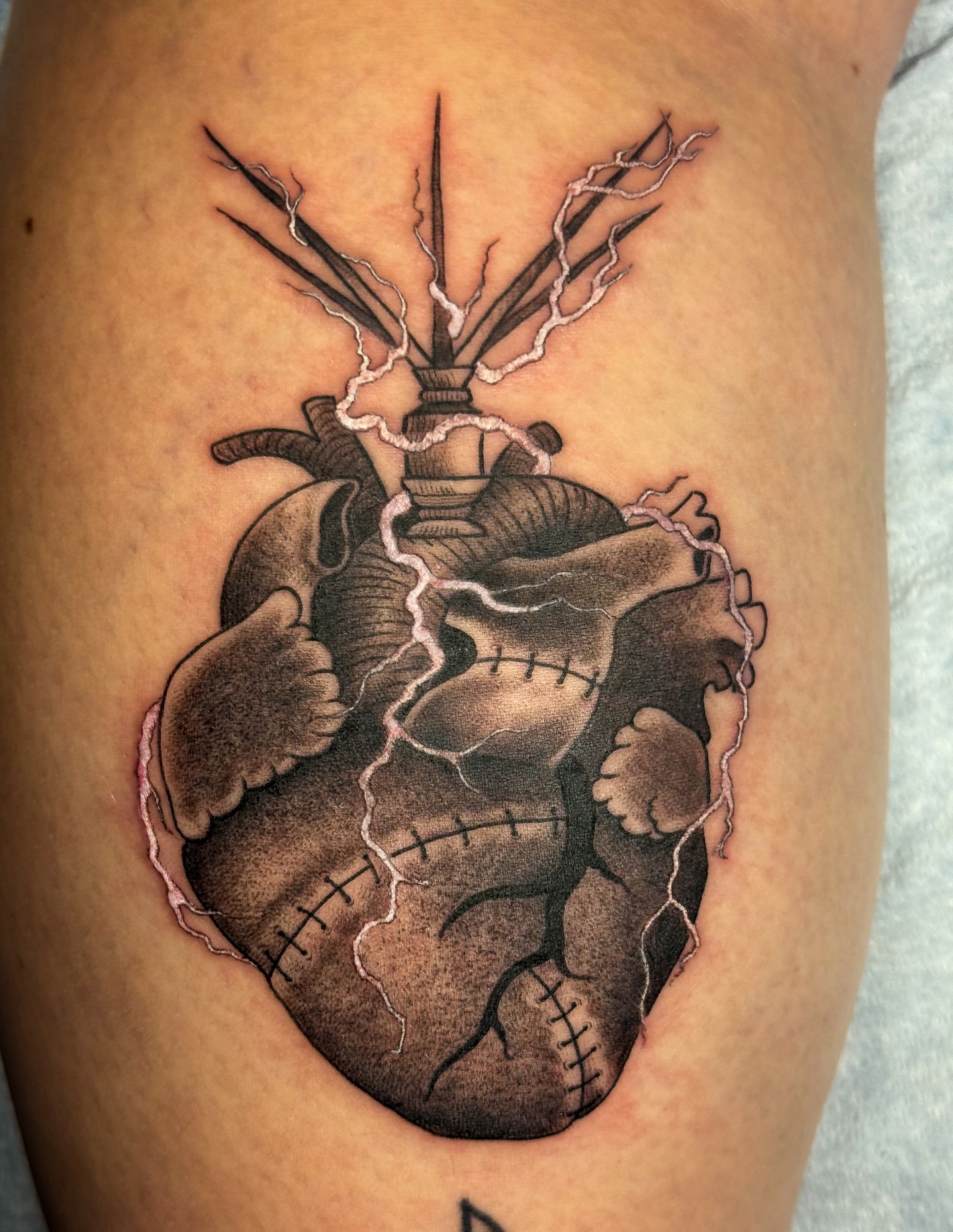 Heart realism tattoo on the thigh by Rhiannon Ross, Lynnwood, Washington