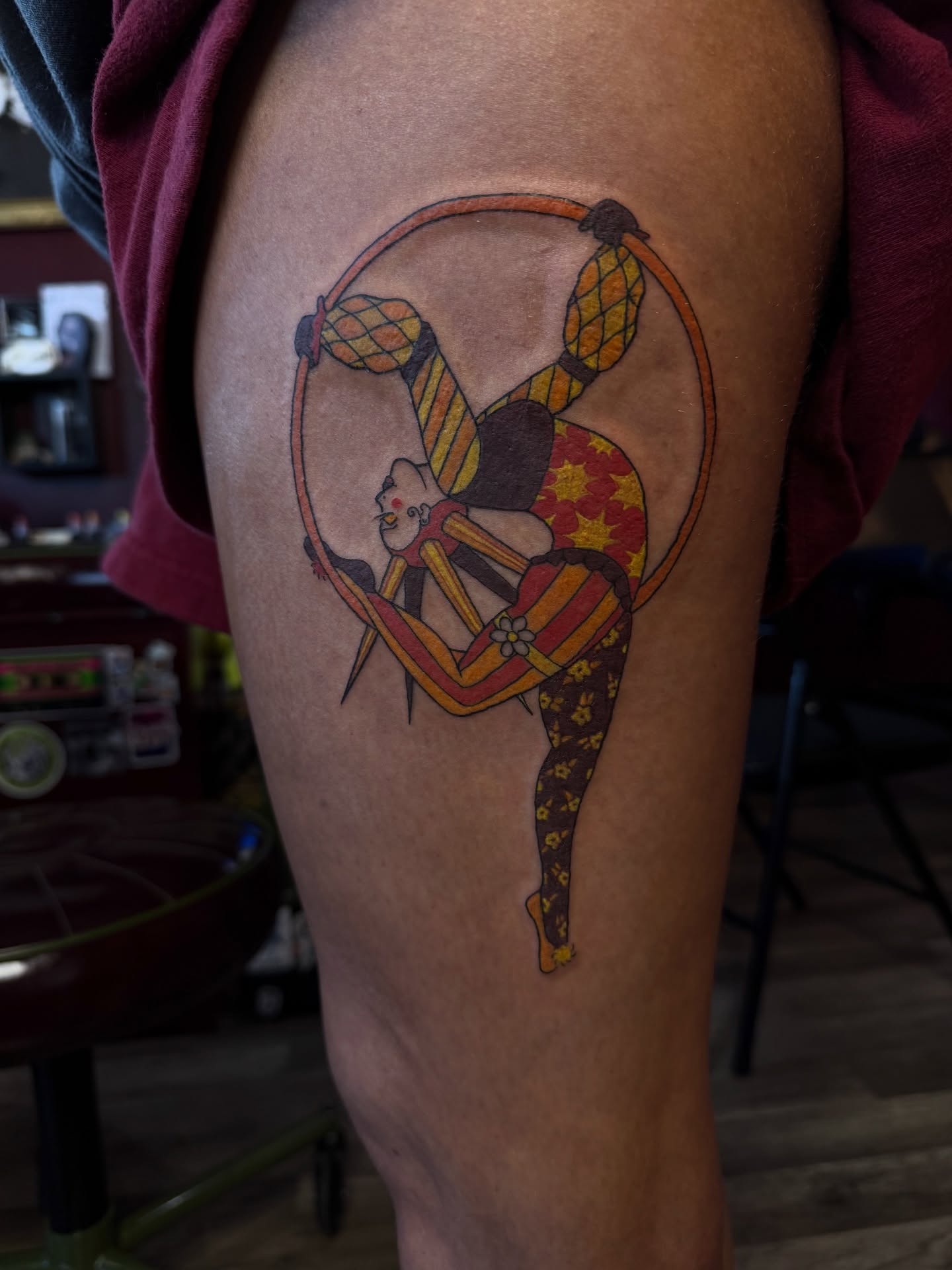 Circus performer illustrative tattoo on the thigh by Stevie Reign