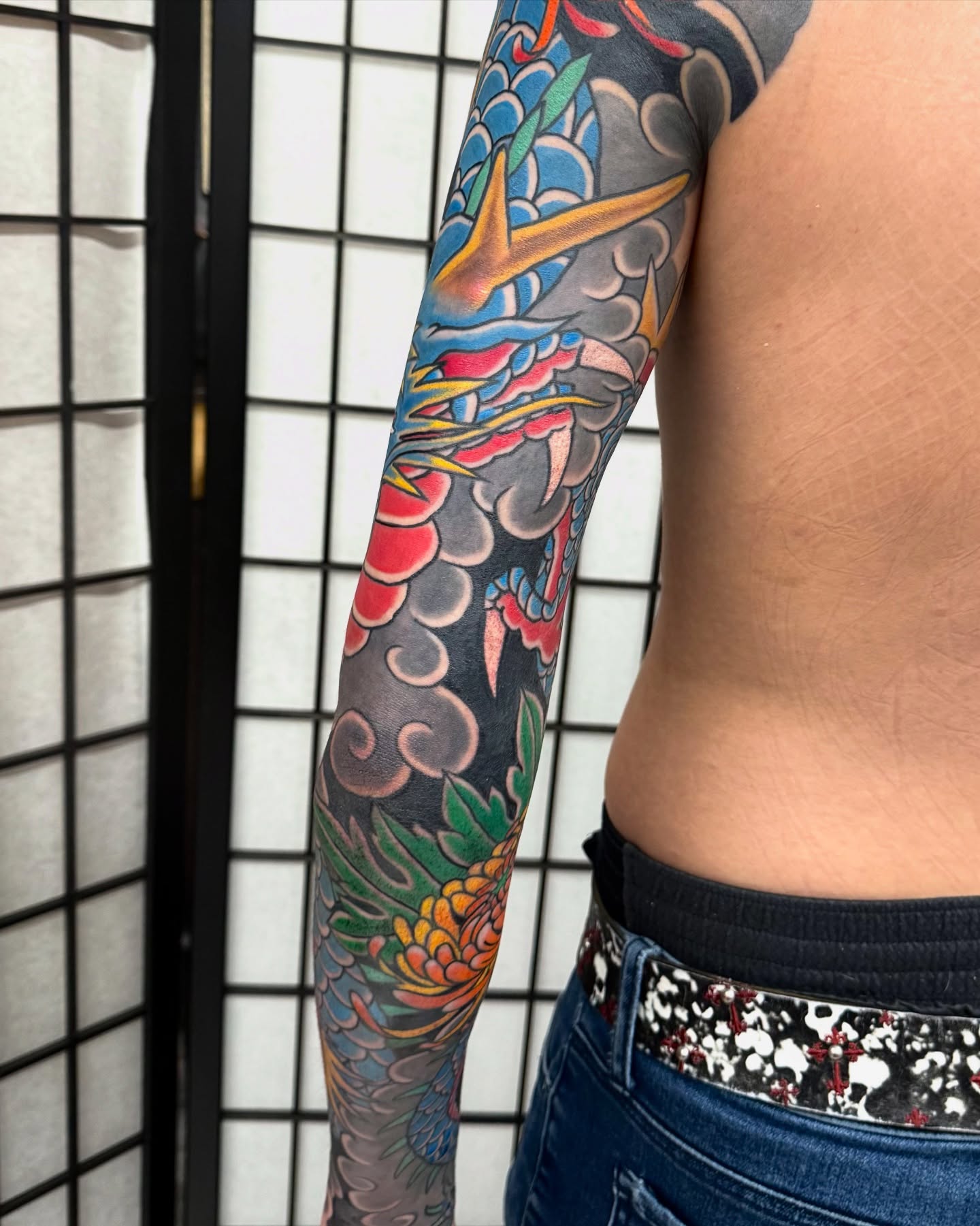 Dragon and clouds japanese irezumi tattoo on the upper arm by Marcos Rivera, Laredo, Texas