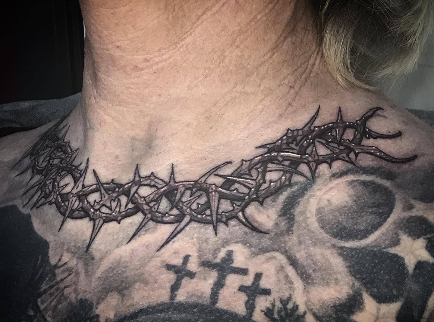 Crown of thorns black and grey tattoo on the neck by Sean Hollinger