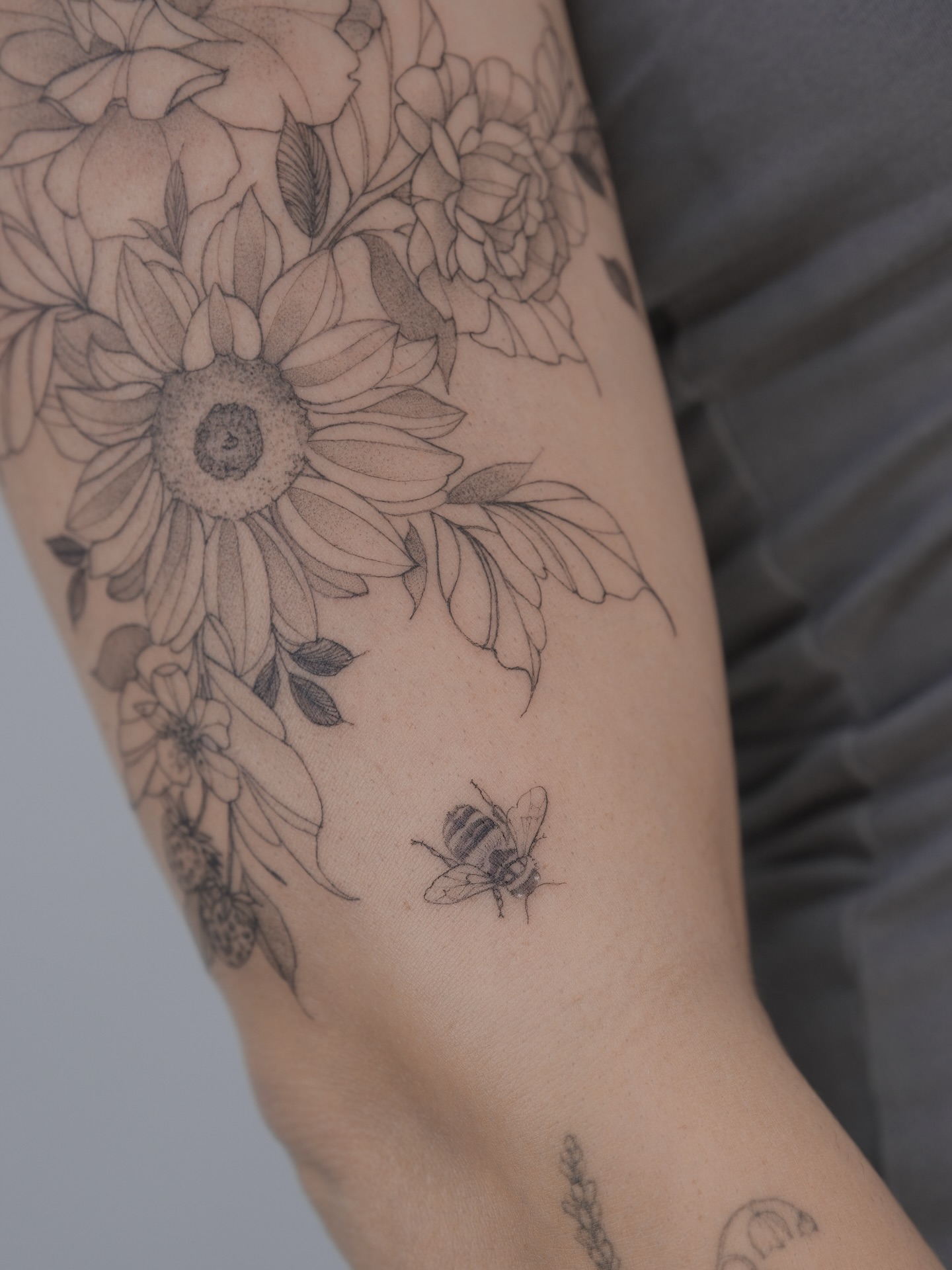 Sunflower bouquet black and grey tattoo on the forearm by Tattoo in Charlotte NC, Charlotte, North Carolina