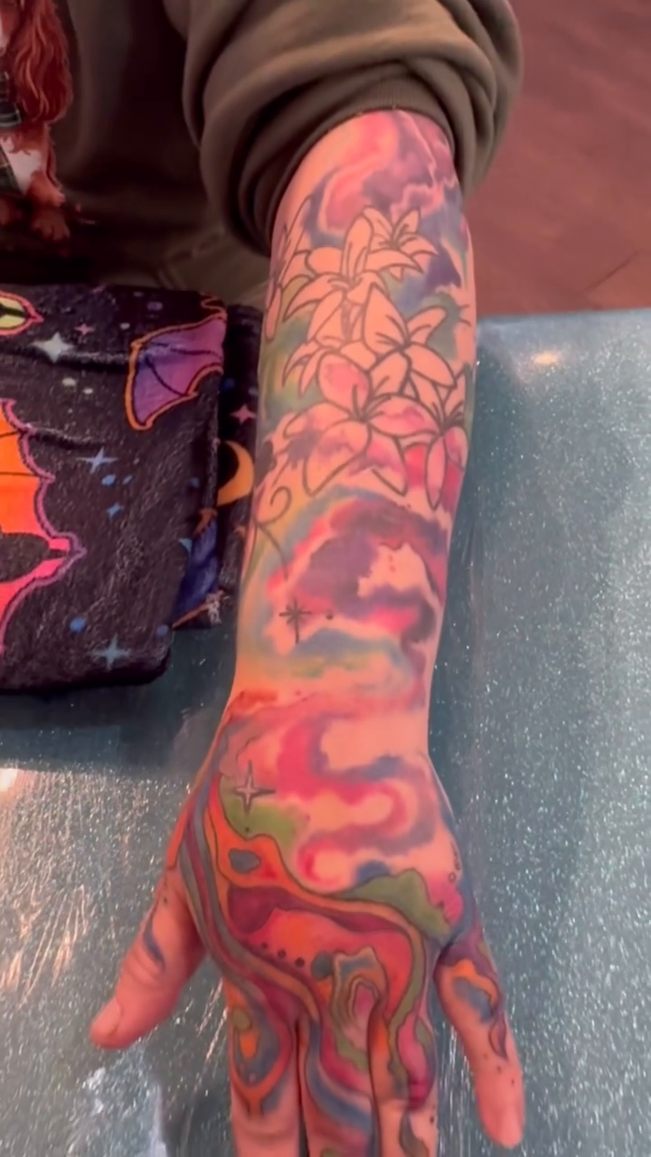 Abstract fluid shapes with floral element trash polka tattoo by Misty Dawn Brothers, Dayton, Ohio