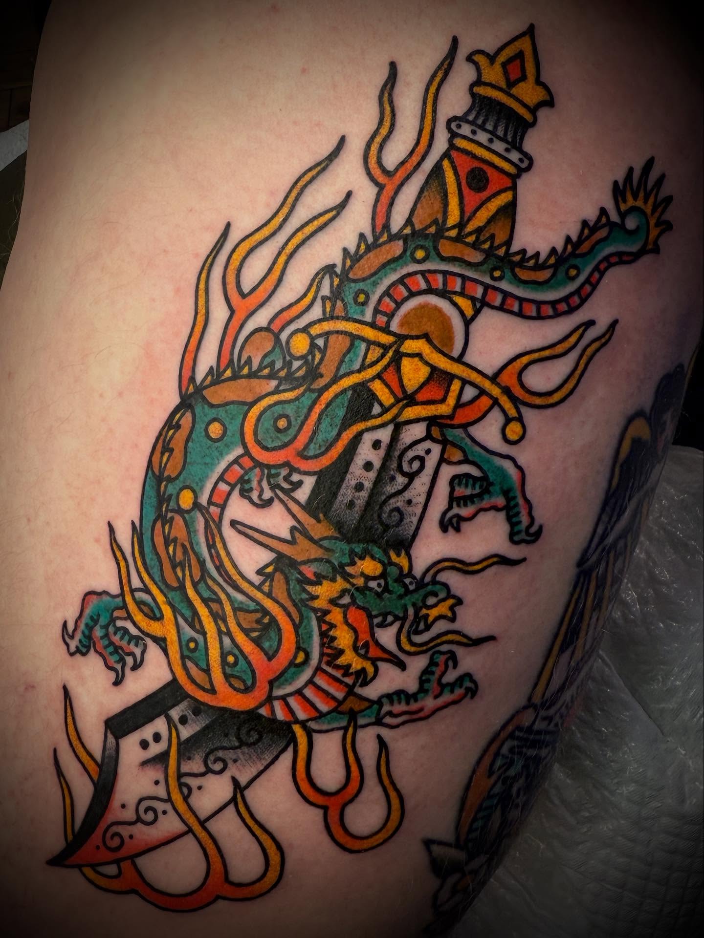 Dragon American traditional tattoo on the thigh by Andrew Slater