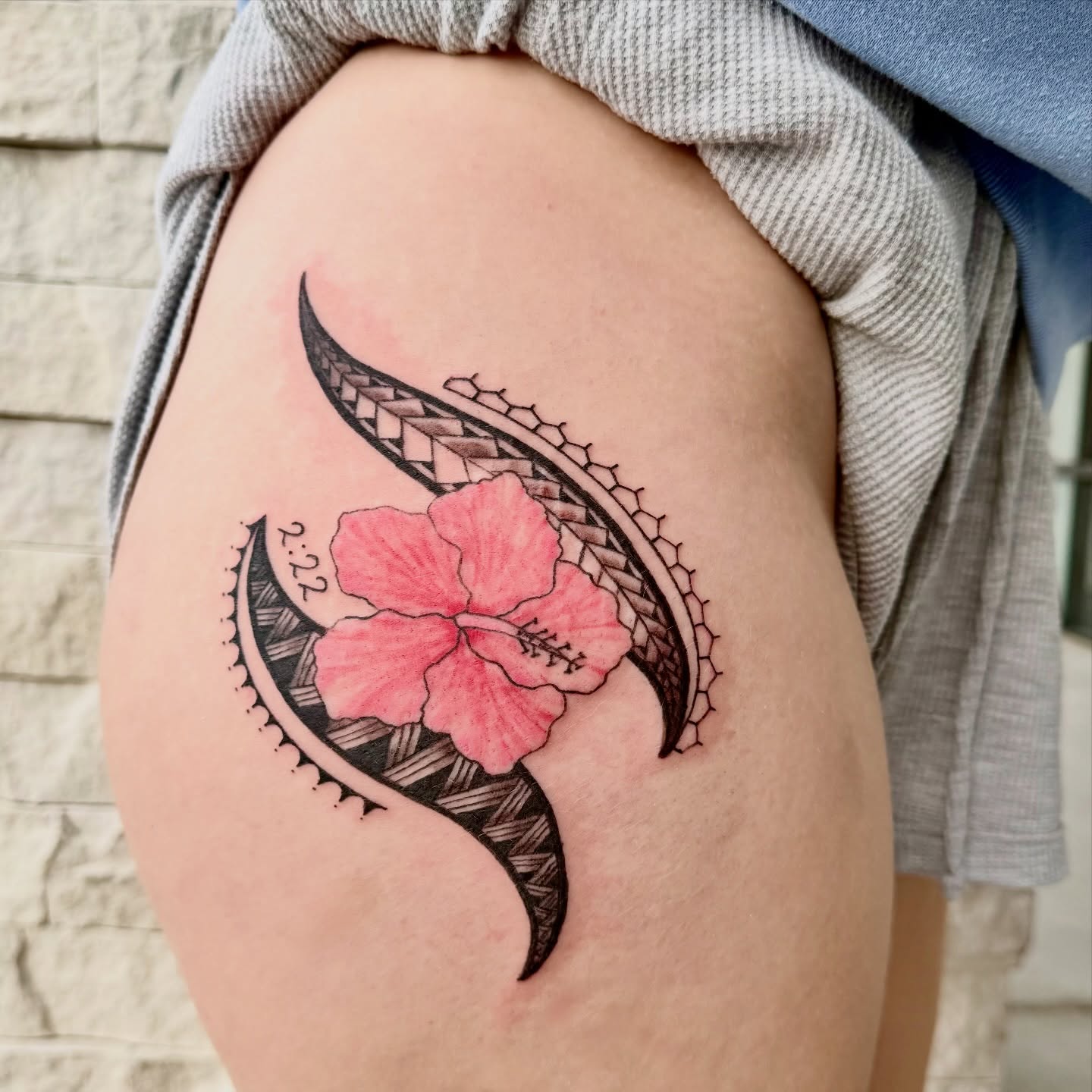 Hibiscus flower American traditional tattoo on the thigh by Healoha “Lindelle” Kamanu