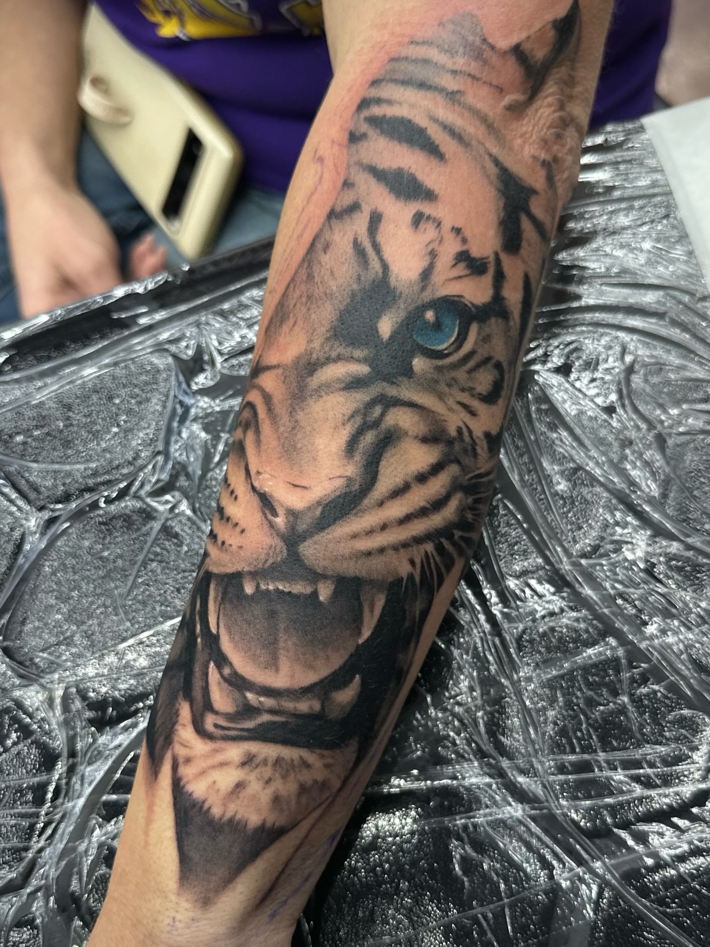 Tiger realism tattoo on the forearm by Trent Hebert