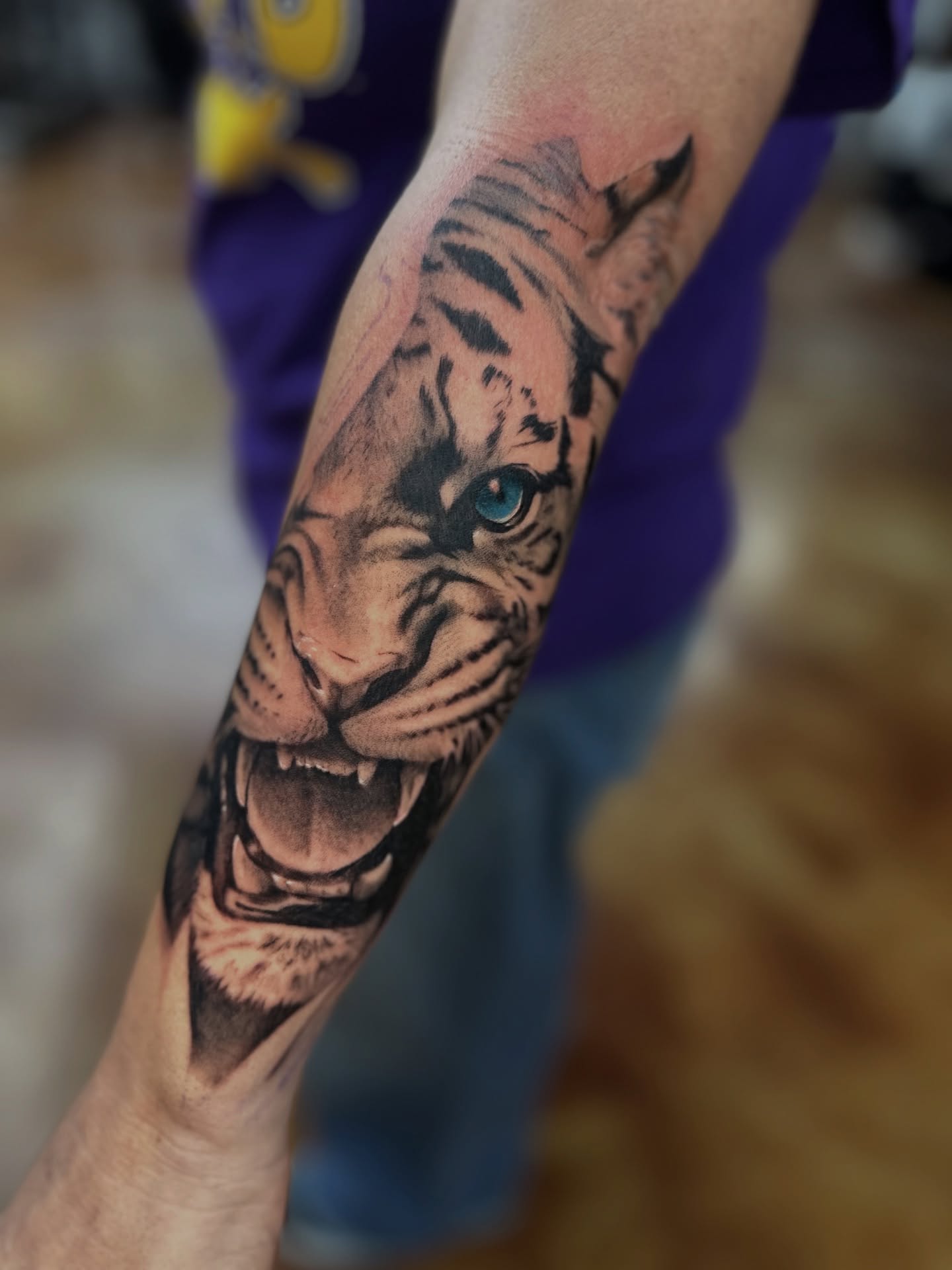 Tiger realism tattoo on the forearm by Trent Hebert