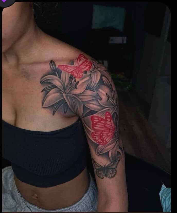 Lilies and butterflies realism tattoo on the shoulder by Detroit tattoo Artist