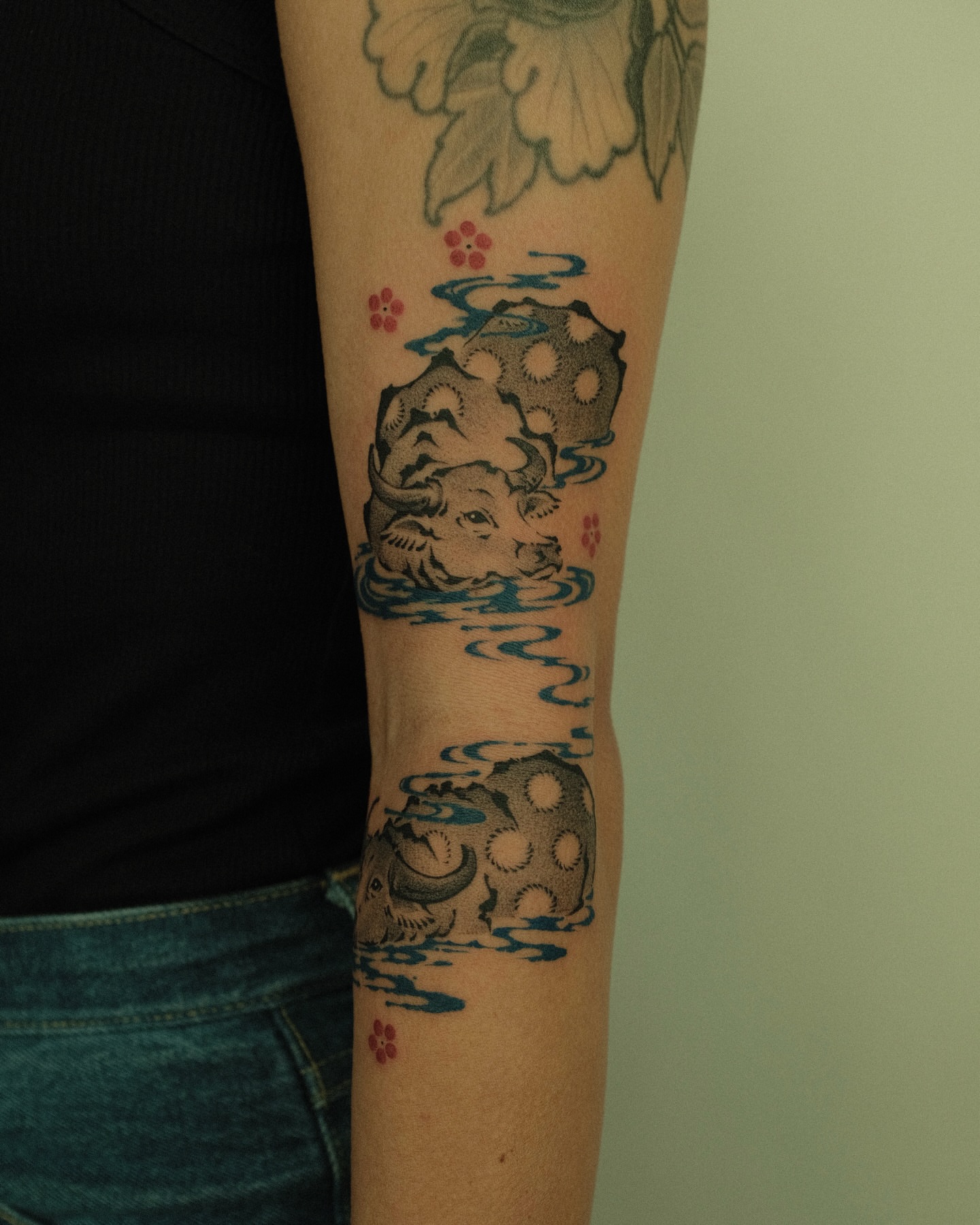 Bull and rock dotwork tattoo on the forearm by Xiao Lun