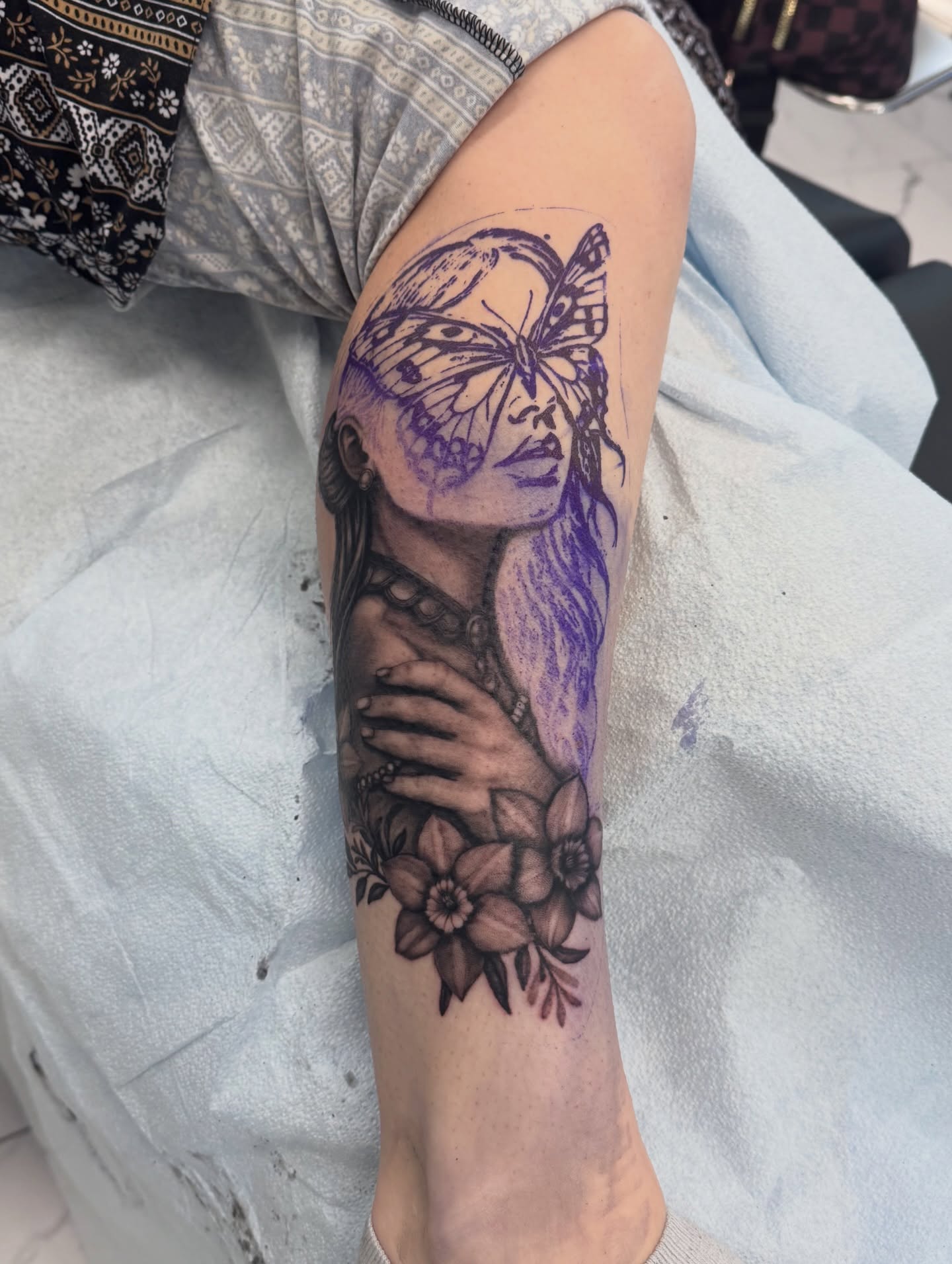 Woman with butterfly realism tattoo on the forearm by utah tattoo artist