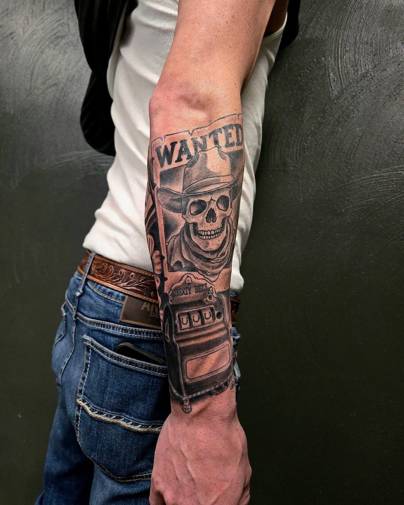 Cowboy skull American traditional tattoo on the forearm by Caleb Moul