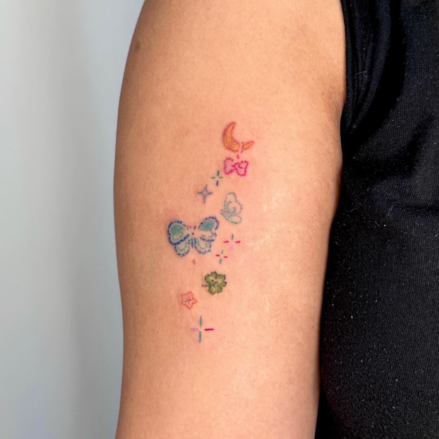 Butterflies and stars dotwork tattoo on the forearm by Yez tattoo