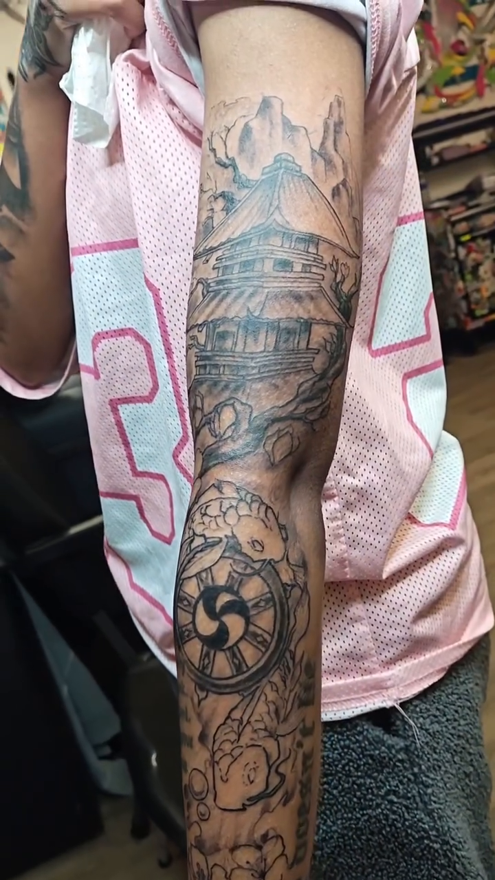 Japanese pagoda and dharma wheel sleeve Japanese tattoo on the forearm by @cvpital
