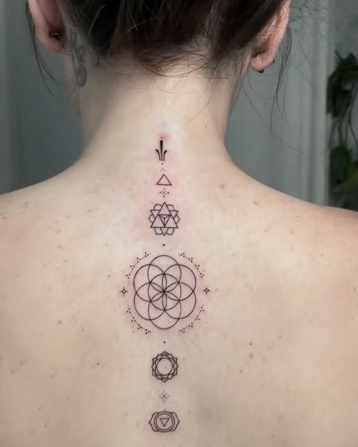 Sacred geometry symbols geometric tattoo on the back by Donavon Batz