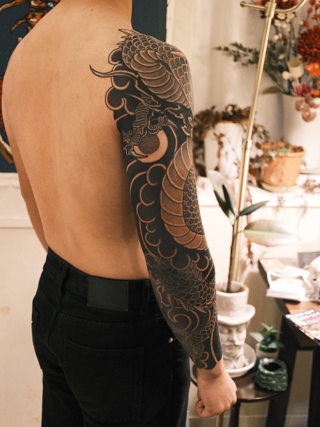 Dragon and moon Japanese tattoo on the upper arm by Kubo