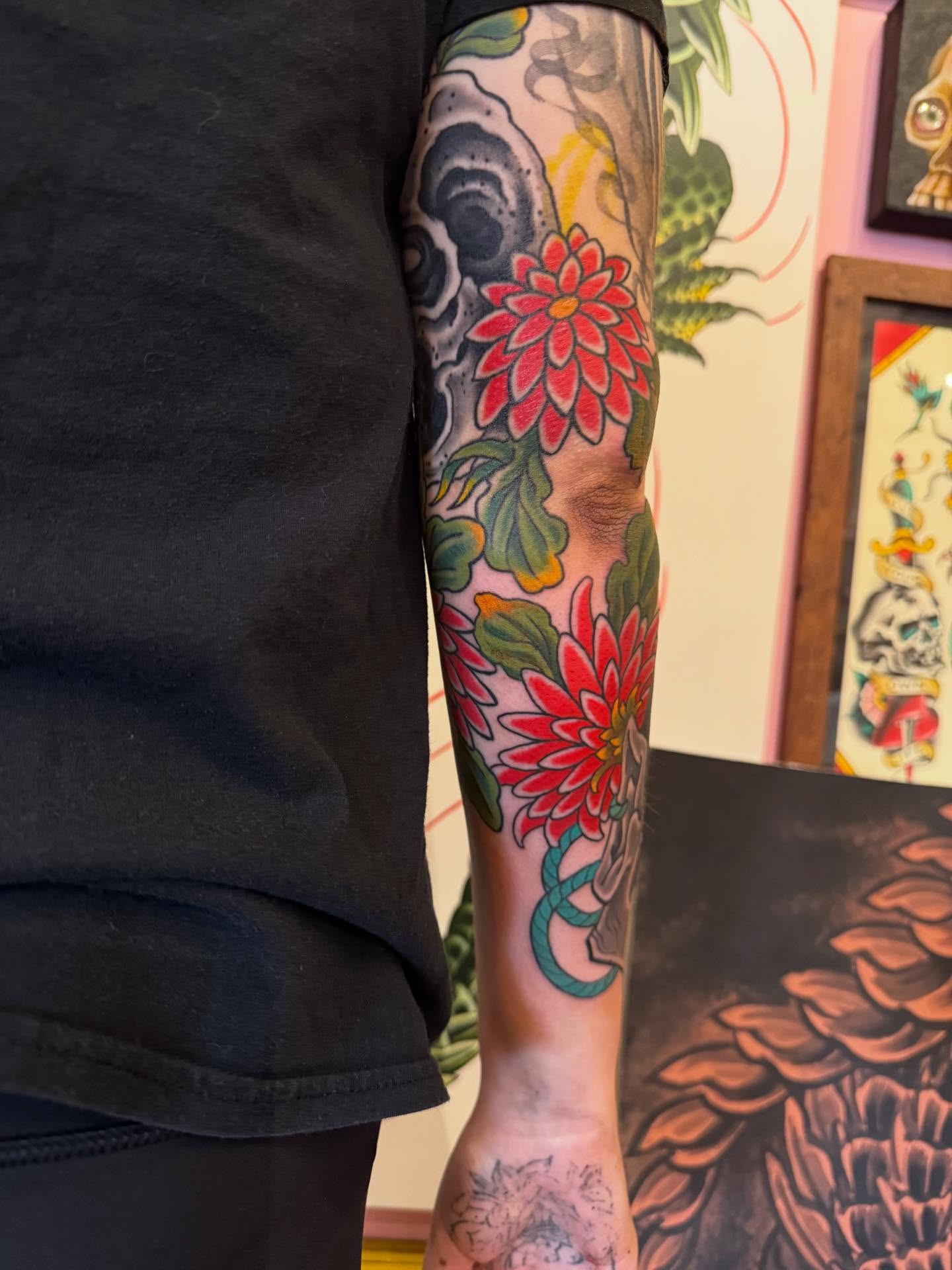Floral arrangement American traditional tattoo on the forearm by Noah Moretz