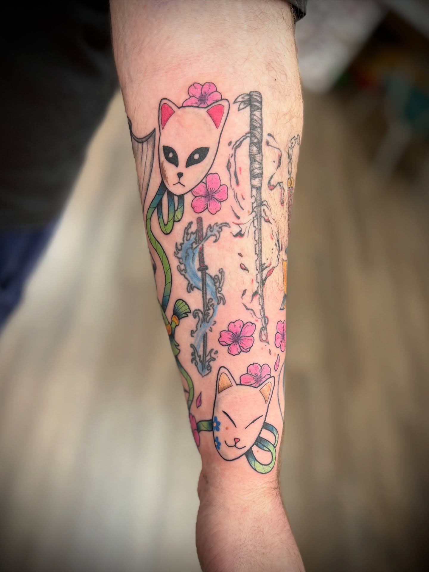 Cat and cherry blossoms japanese irezumi tattoo on the forearm by Justin Bianchini - New Orleans Tattoo Artist