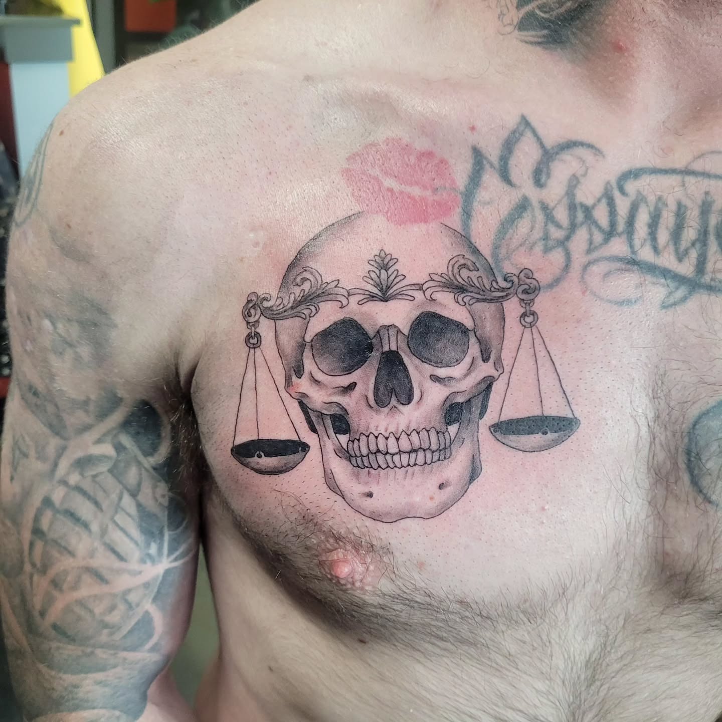 Skull with scales realism tattoo on the chest by Aspen C