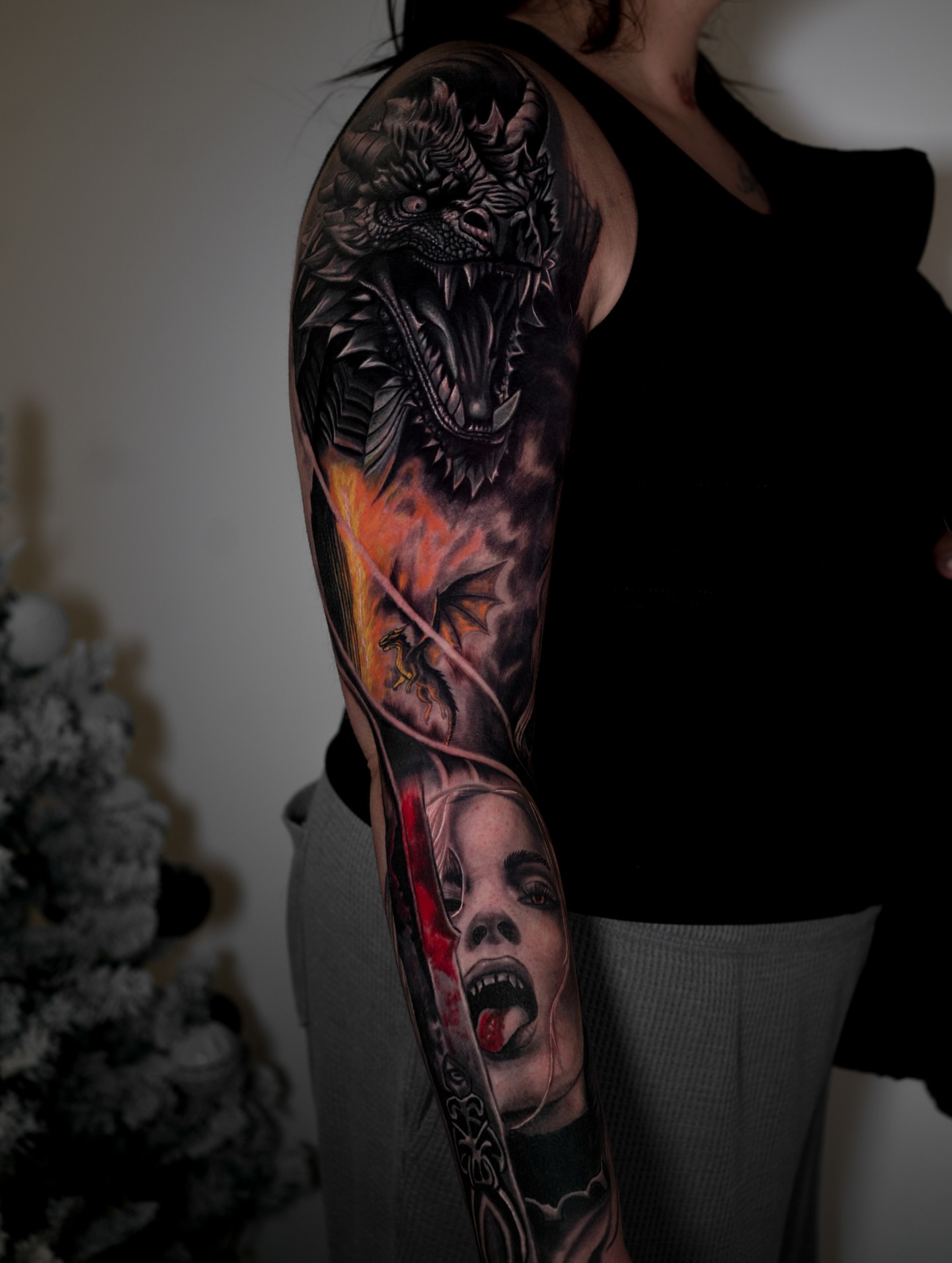 Dragon and woman realism tattoo on the forearm by Juan David Arias